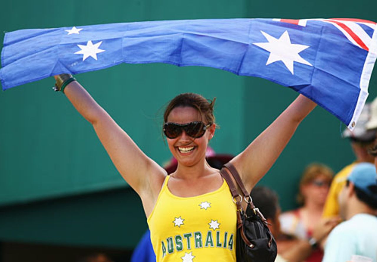 An Australia fan holds aloft her country's flag after their crushing nine-wicket win, Australia v Ireland, Super Eights, Barbados, April 13, 2007