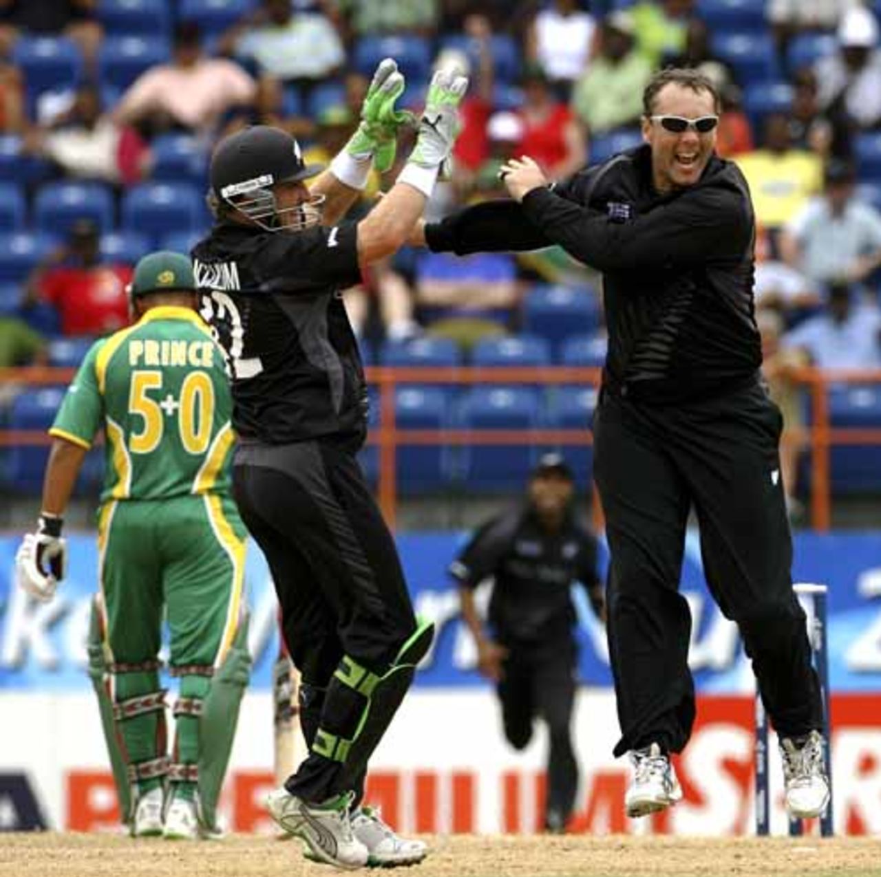Craig McMillan celebrates with Brendon McCullum after bagging the first of his three wickets, New Zealand v South Africa, Super Eights, Grenada, April 14, 2007