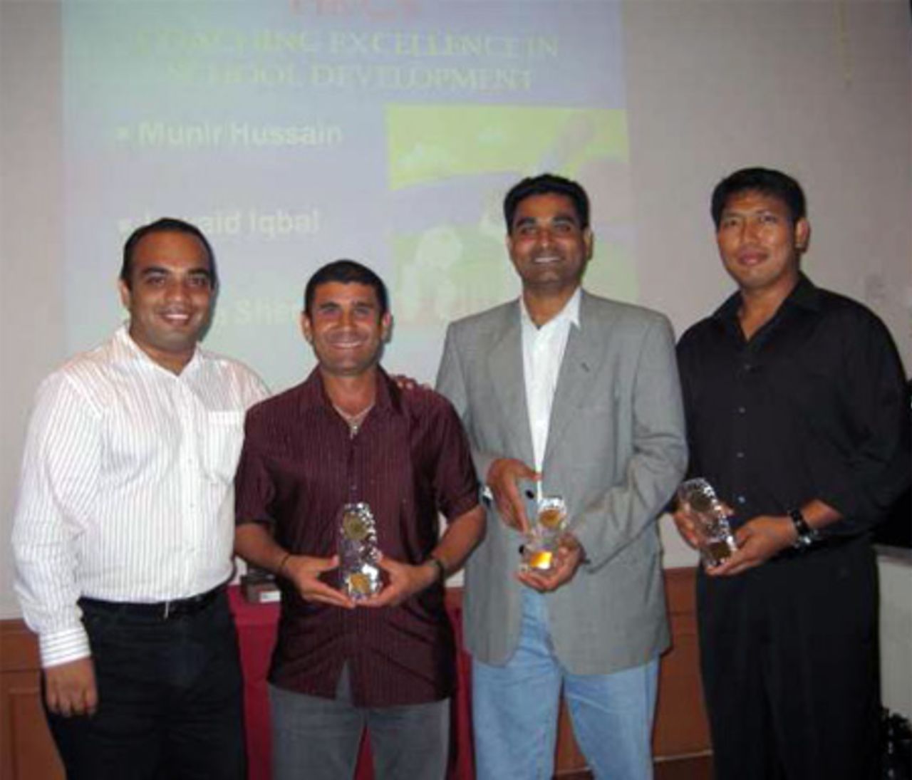 Ravi Nagdev presents trophies to Jawaid Iqbal, Munir Hussain and Sher Lama at the 2006 HKCA Coaching Awards