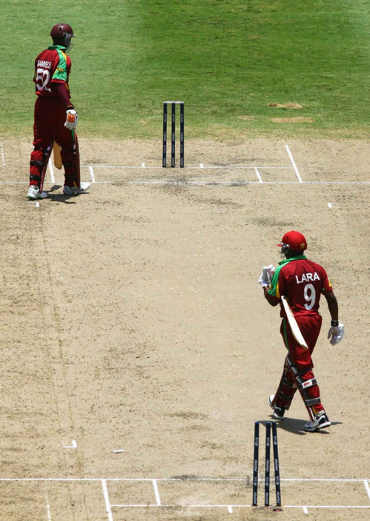 Brian Lara heads for the pavilion after being run-out, while Marlon Samuels can only reflect on what's he done, England v West Indies, Super Eights, Barbados, April 21, 2007