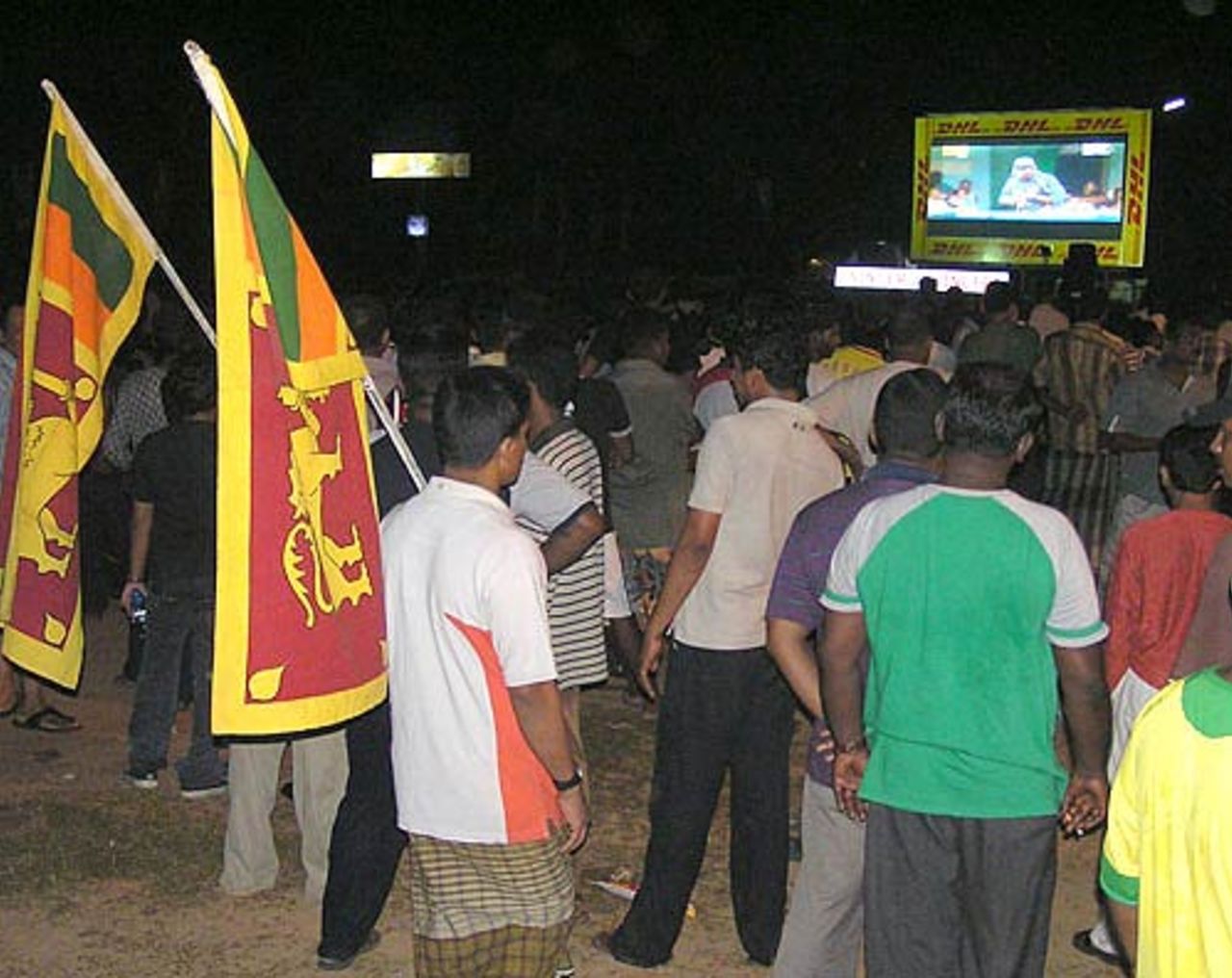 Sri Lankan fans in Colombo catch the semi-final action through the big screen, Colombo, April 24, 2007