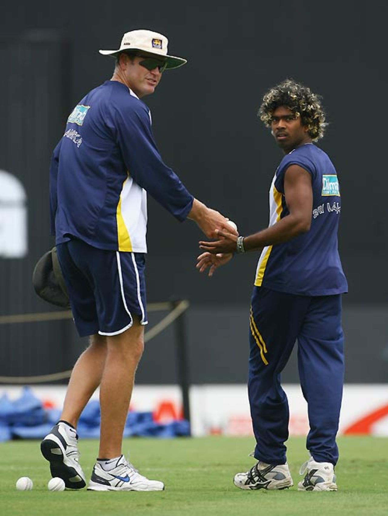 Tom Moody instructs Lasith Malinga to have a bowl at the nets, Barbados, April 27, 2007