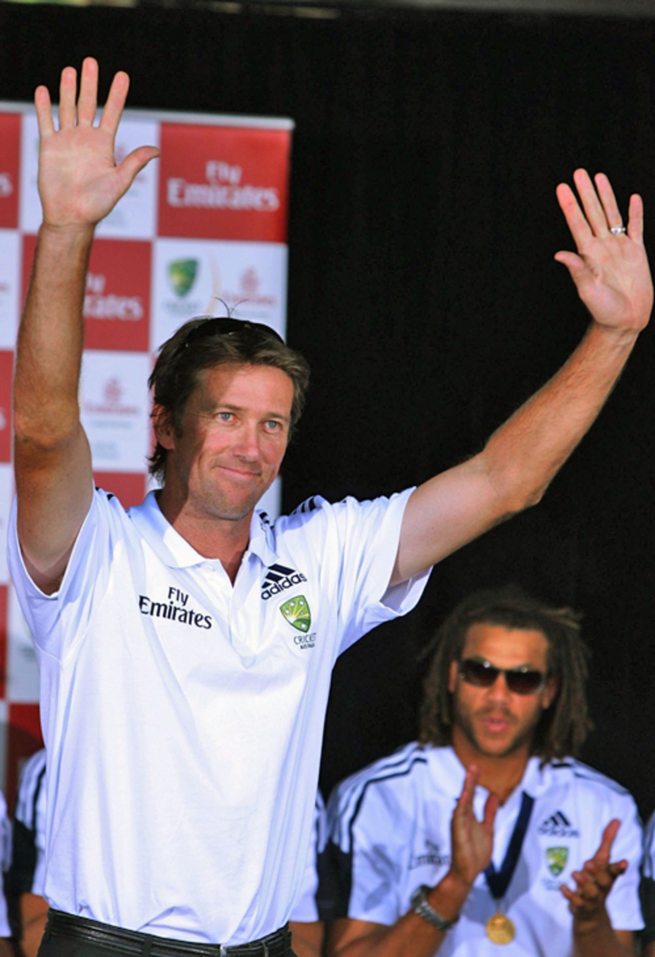 Australian bowler Glenn McGrath waves during a welcome home reception for the Australian Cricket team, Martin Place, Sydney, May 3, 2007