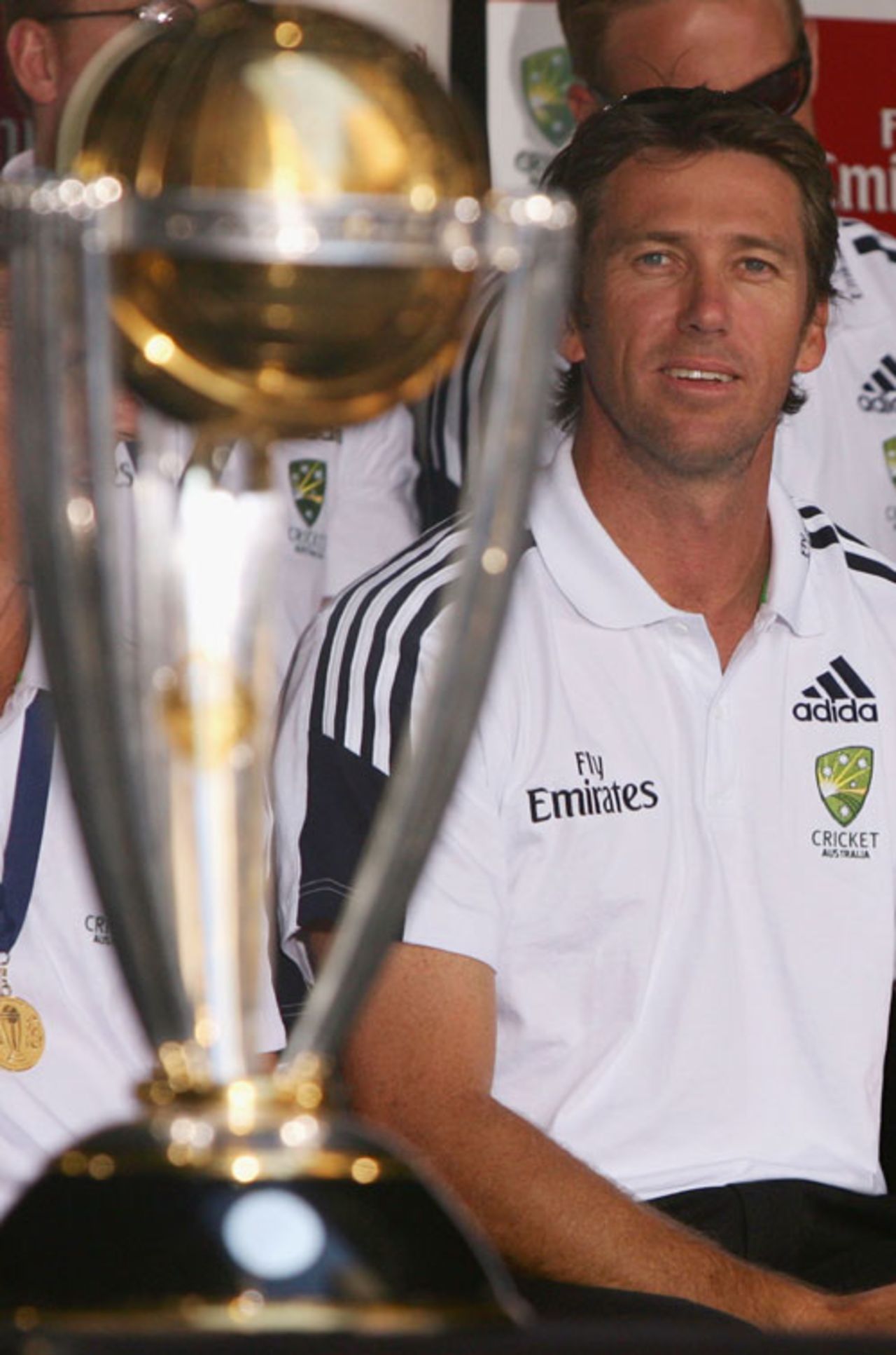 Glenn McGrath checks out the trophy during a welcome home reception for the Australian Cricket team, Martin Place, Sydney, May 3, 2007