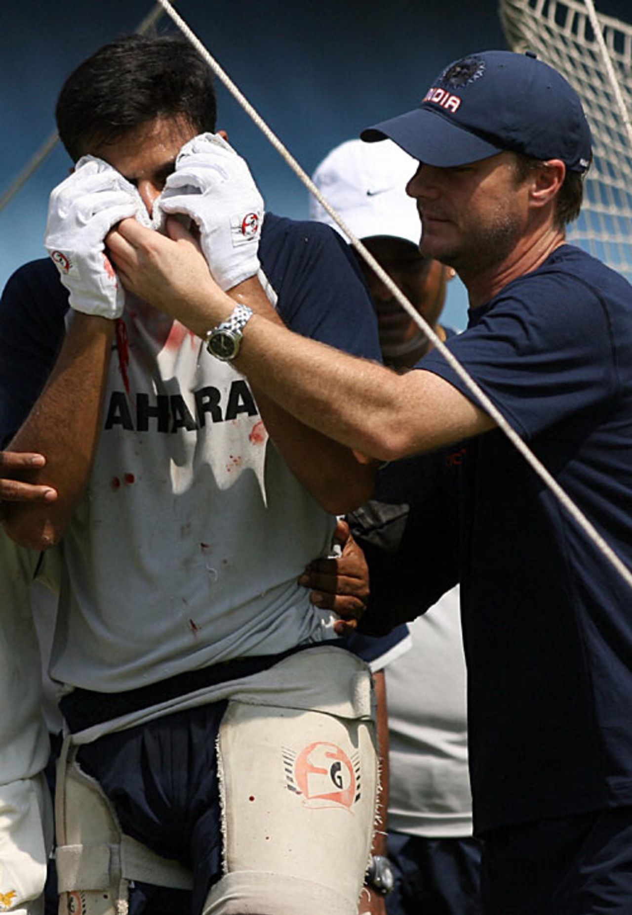 A bloody Rahul Dravid is helped out of the nets after being hit on the nose, Eden Gardens, Kolkata, May 5, 2007