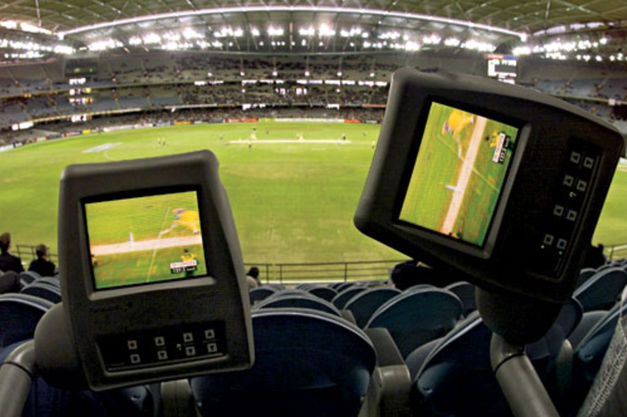 Television screens foreground the play at a one-dayer between South Africa at Melbourne's Colonial Stadium