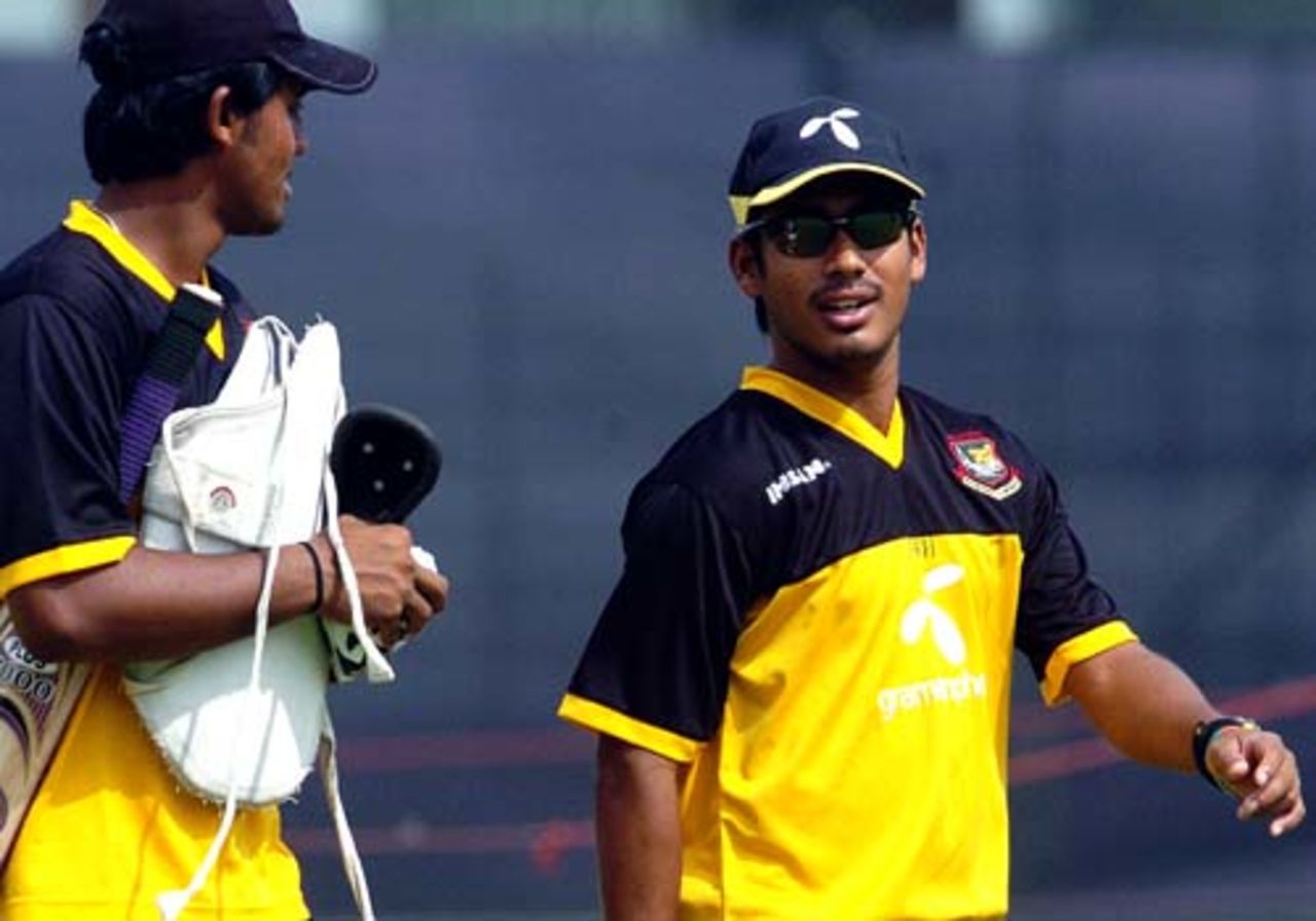 Mohammad Ashraful and Shahriar Nafees arrive at the ground for a net session at Mirpur, Dhaka, May 9, 2007