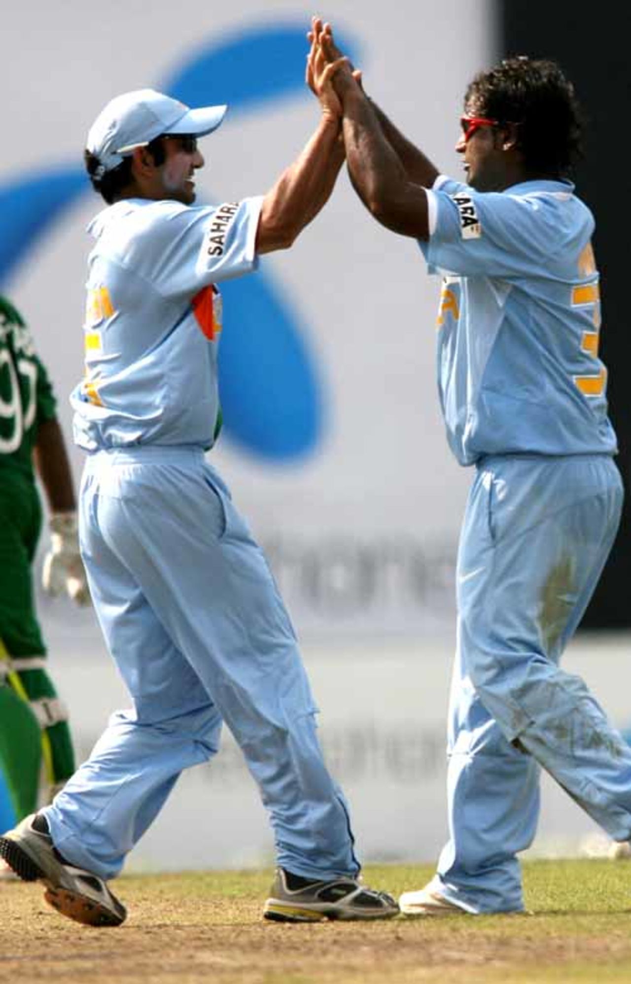 Gautam Gambhir and Ramesh Powar celebrate the dismissal of Aftab Ahmed, Bangladesh v India, 2nd ODI, Mirpur, May 12, 2007