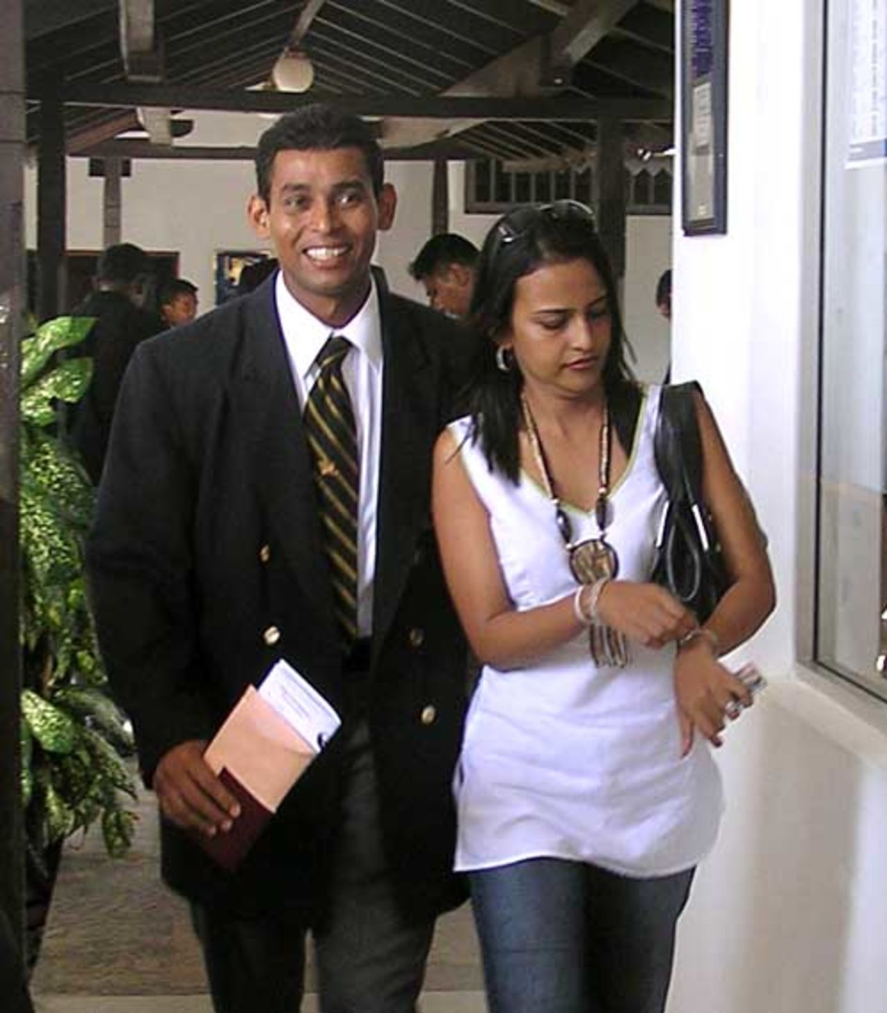 Sri Lanka's vice-captain Tillakaratne Dilshan is accompanied by his wife while leaving for the Abu Dhabi series, Colombo, May 15, 2007