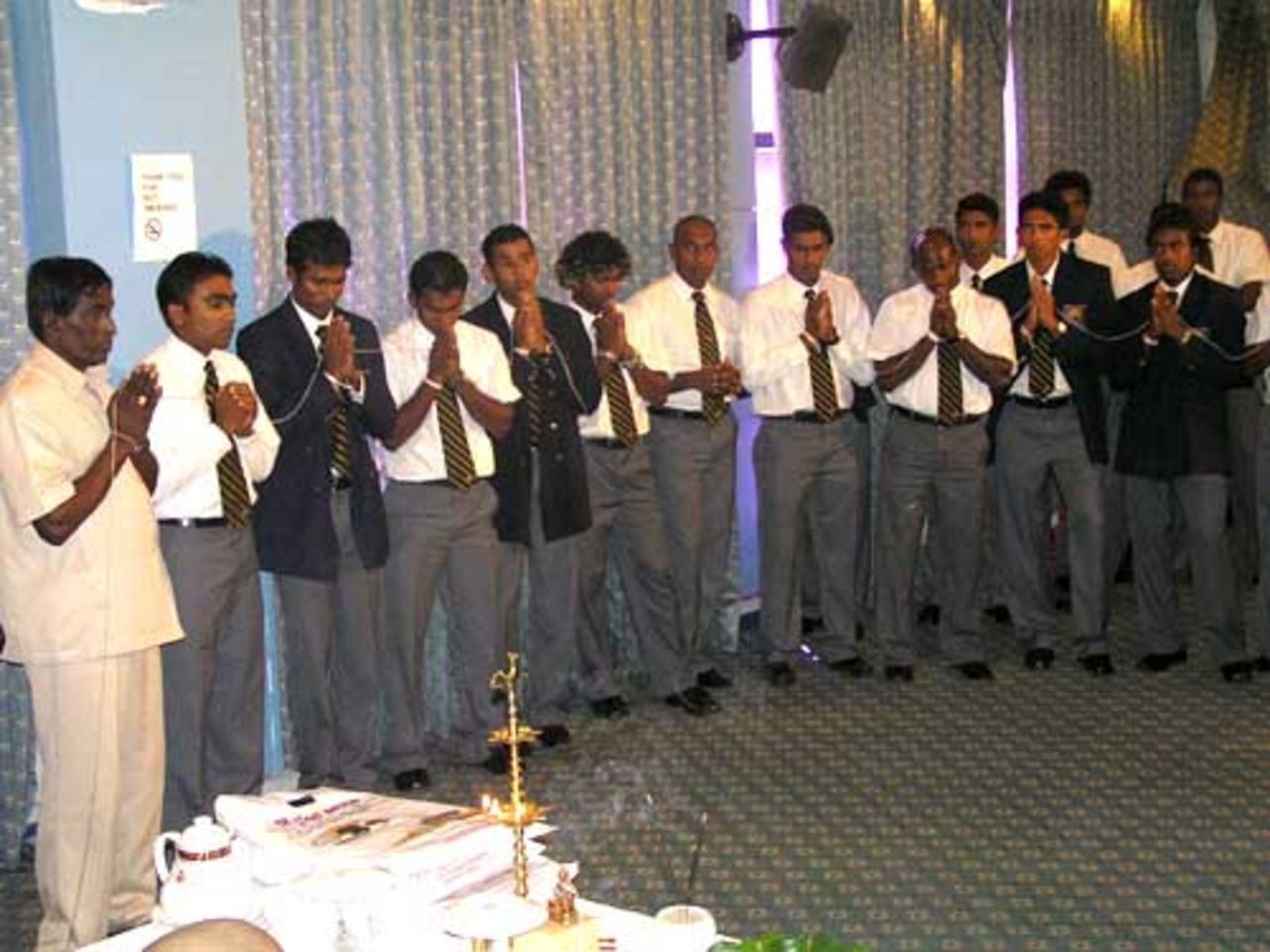 Members of the Sri Lankan squad utter a prayer before their departure for the Abu Dhabi series, Colombo, May 15, 2007