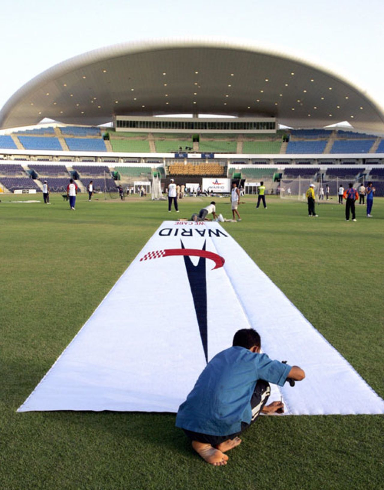 Last-minute preparations to the pitch ahead of the opening game, Abu Dhabi, May 17, 2007
