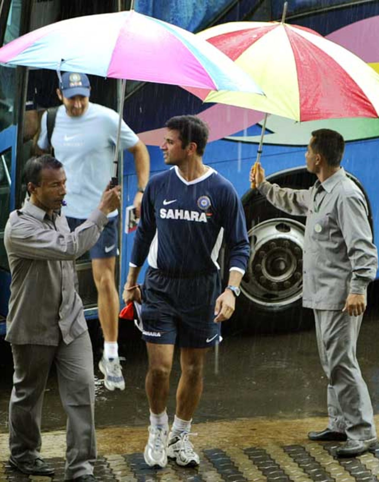 Rahul Dravid steps into a city hotel during a spell of rain, Chittagong, May 19, 2007