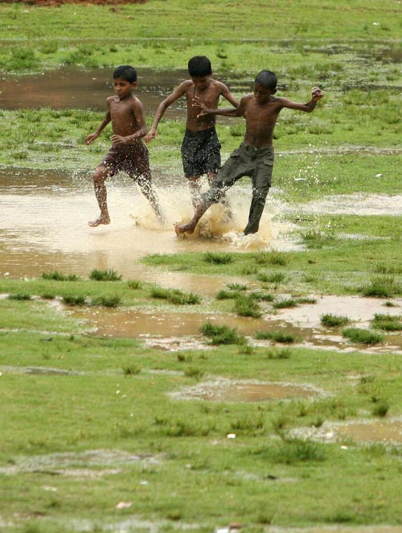 The boys take to football as the rain continued to fall in Chittagong, Bangladesh v India, 1st Test, Chittagong, 3rd day, May 20, 2007
