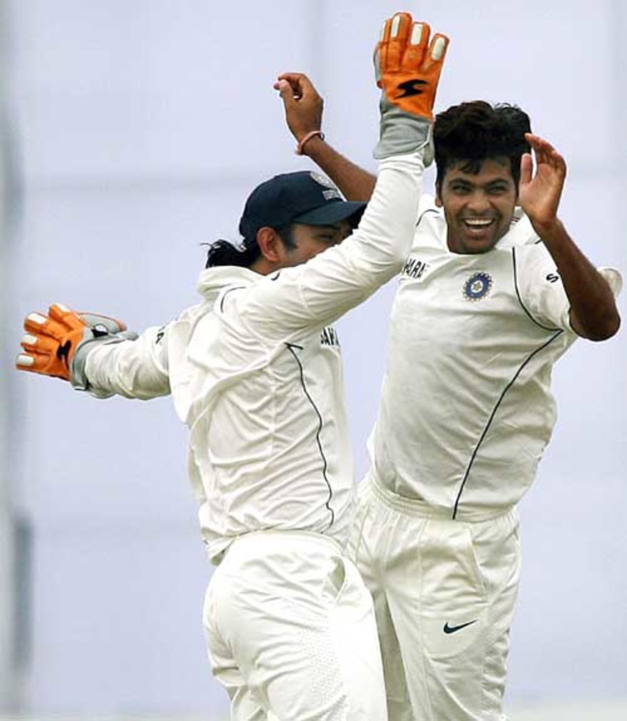 Rudra Pratap Singh and wicket keeper Mahender Singh Dhoni celebrate the dismissal of Shahriar Nafees,  Bangladesh v India, 1st Test, Chittagong, 5th day 