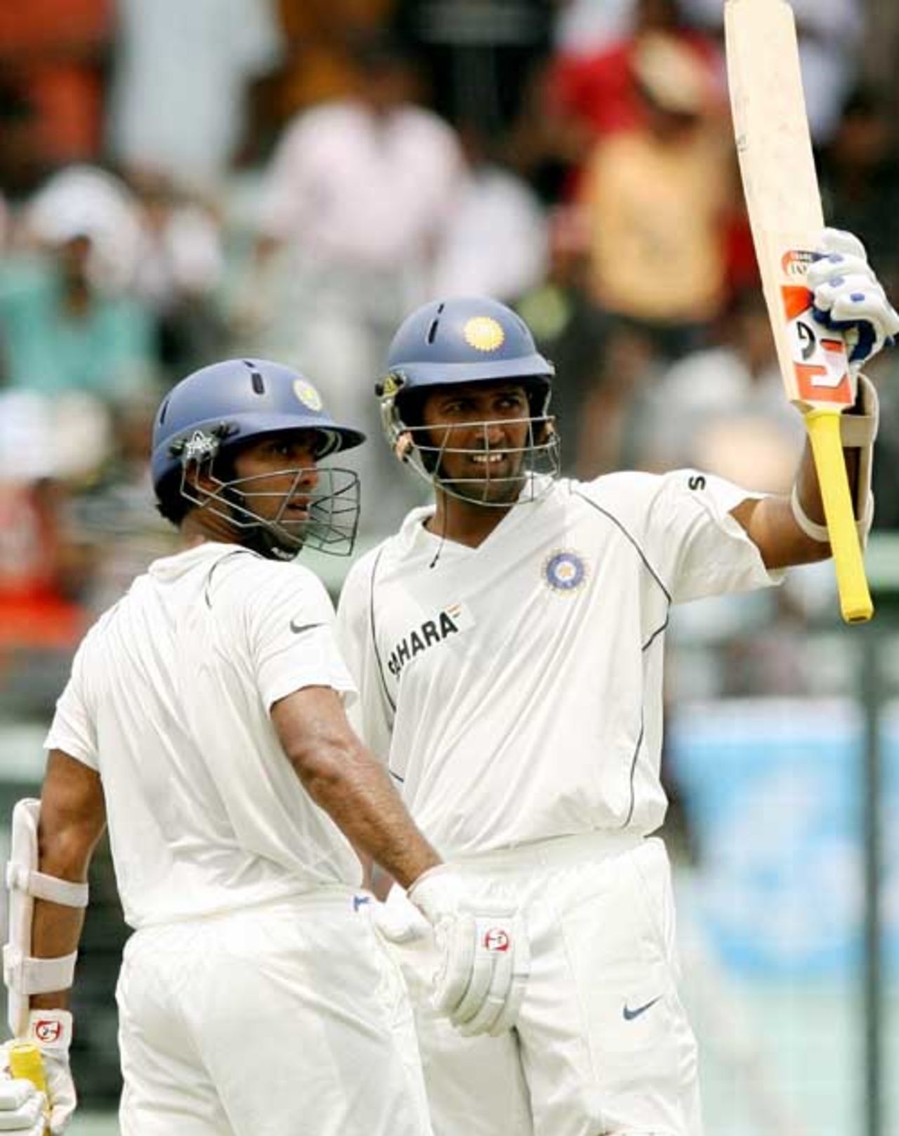 Wasim Jaffer raises his bat after reaching his half-century as Dinesh Karthik looks on, Bangladesh v India, 2nd Test, Mirpur, 1st day, May 25, 2007