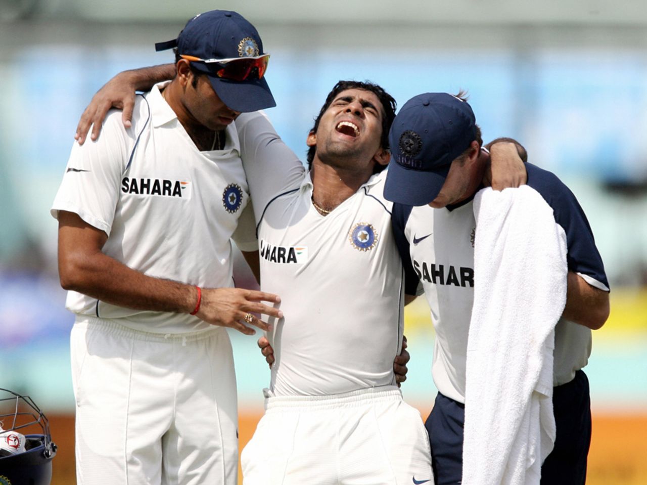 Dinesh Karthik winces in pain as he is taken off the field, Bangladesh v India, 2nd Test, Mirpur, 1st day, May 25, 2007