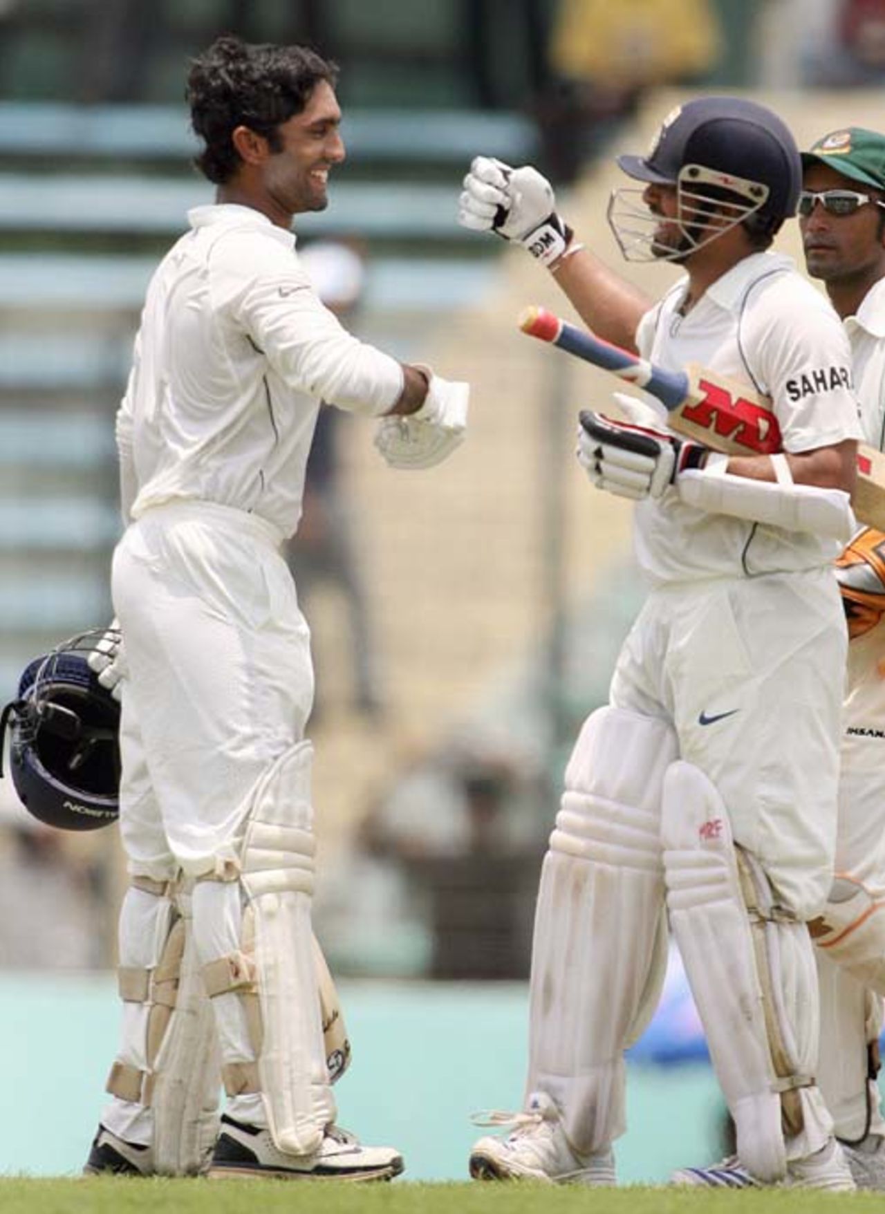 Dinesh Karthik is congratulated by Sachin Tendulkar on his maiden Test century,Bangladesh v India, 2nd Test, Mirpur, 2nd day, May 26, 2007