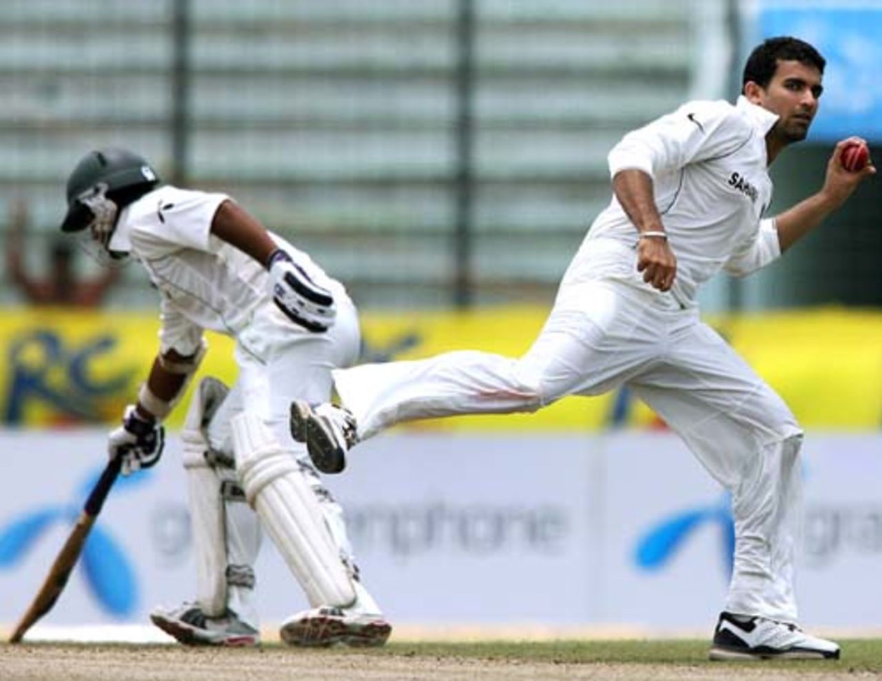 Zaheer Khan fields the ball off his own bowling, Bangladesh v India, 2nd Test, 3rd day, Mirpur, May 27, 2007