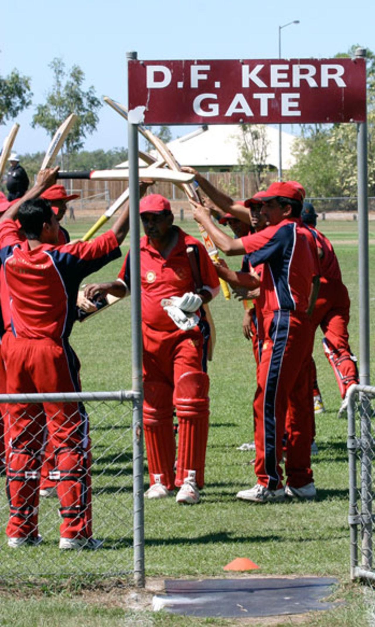 The Hong Kong players give Rahul Sharma a guard of honour after he scored 85 in his last innings against Tanzania, Darwin, June 2, 2007 