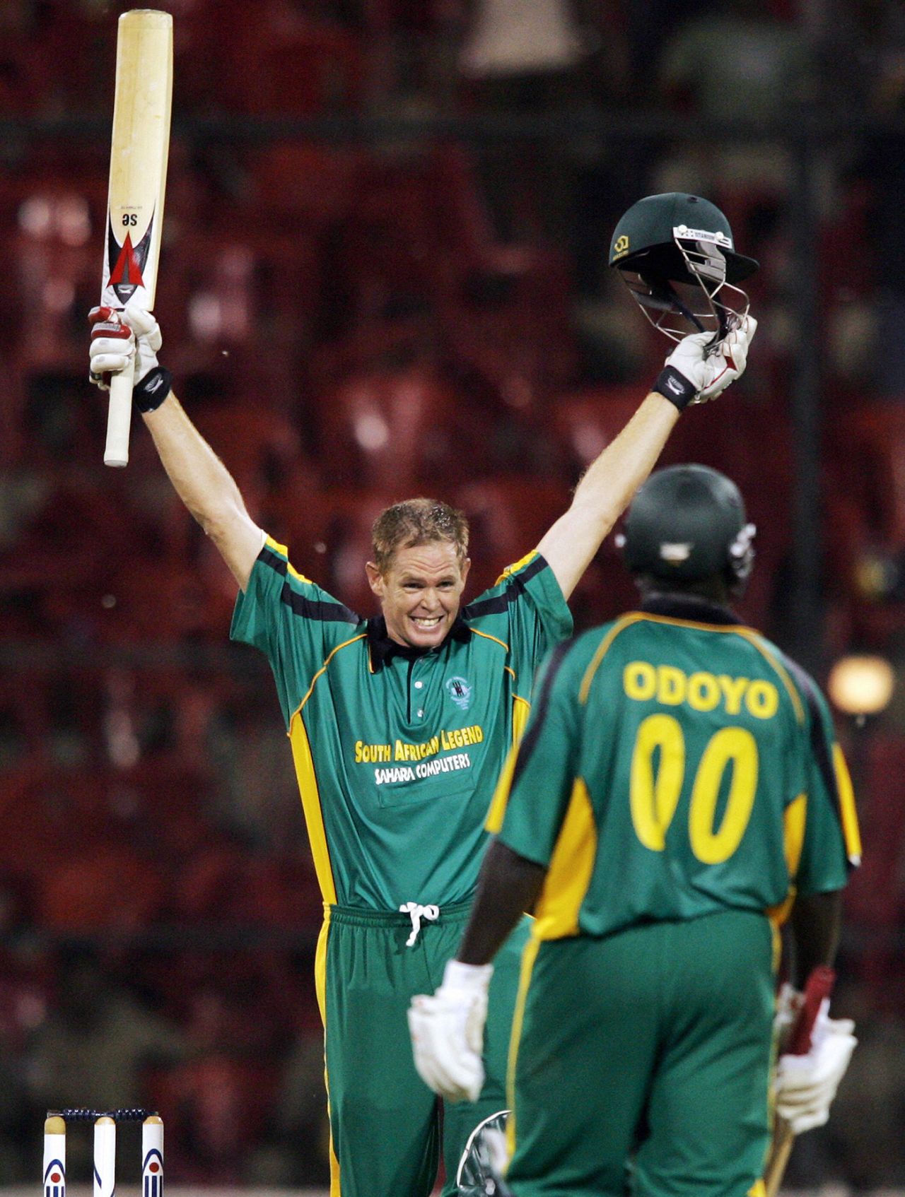 Shaun Pollock is ecstatic on his maiden ODI century with team mate Odoyo, 1st ODI, Afro Asia Cup, Bangalore, June 6, 2007