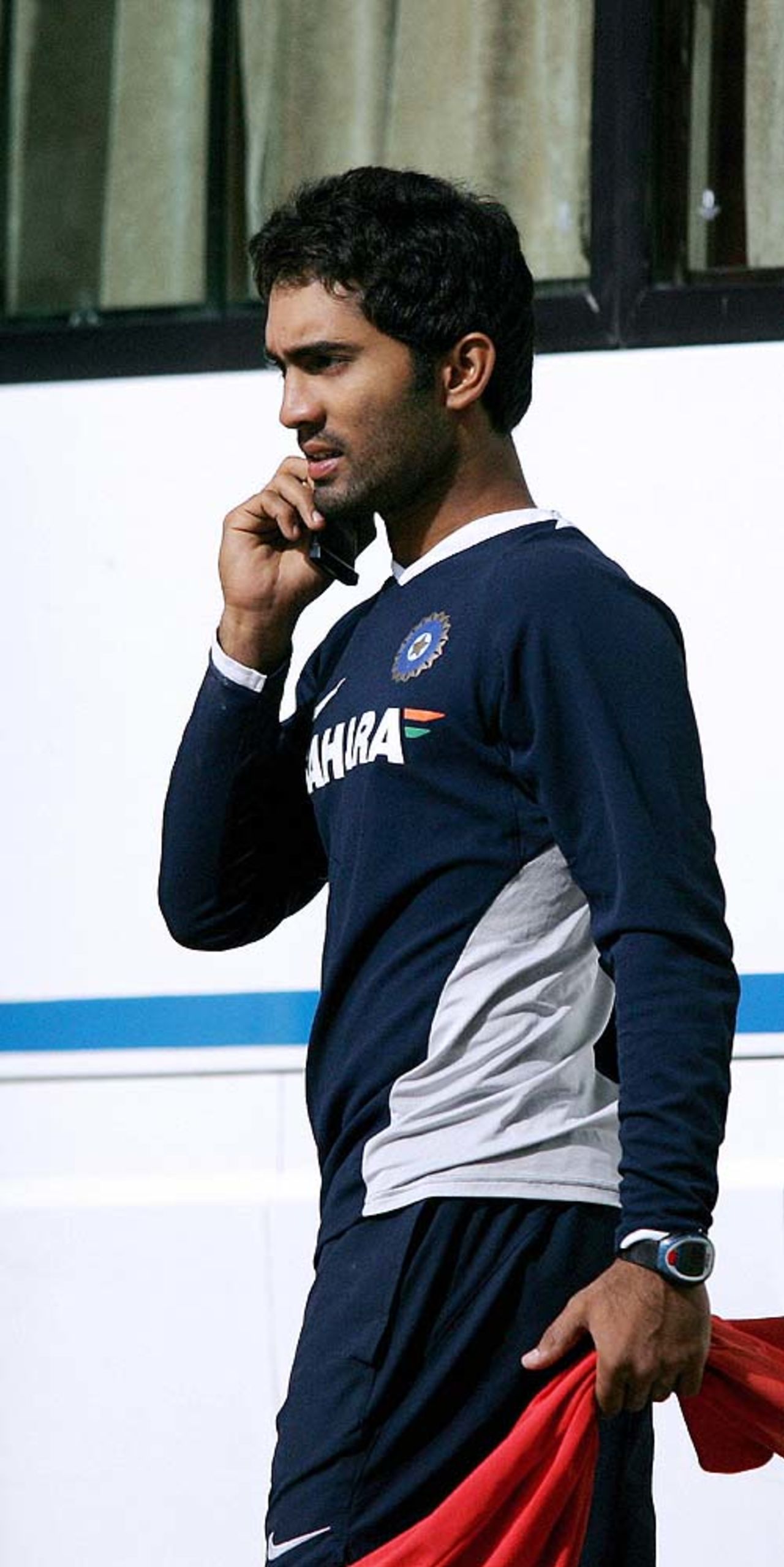 Dinesh Karthik walks out at the end of the first day of a batsmen camp at the National Cricket Academy, Bangalore, June 09, 2007
