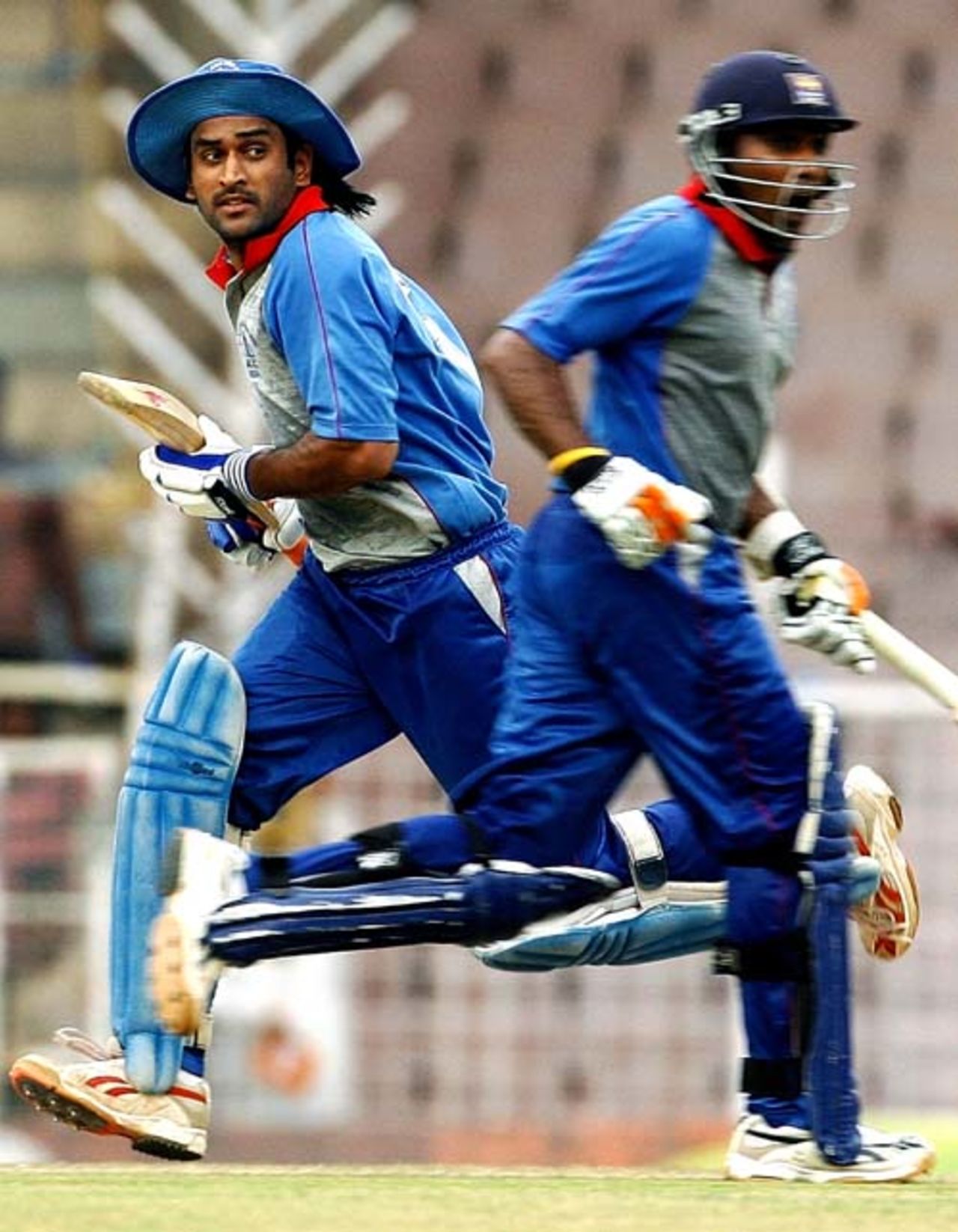 MS Dhoni and Mahela Jayawardene take a single during their double century stand in a century stand in the third ODI of the Afro-Asia cup at Chennai, June 10, 2007