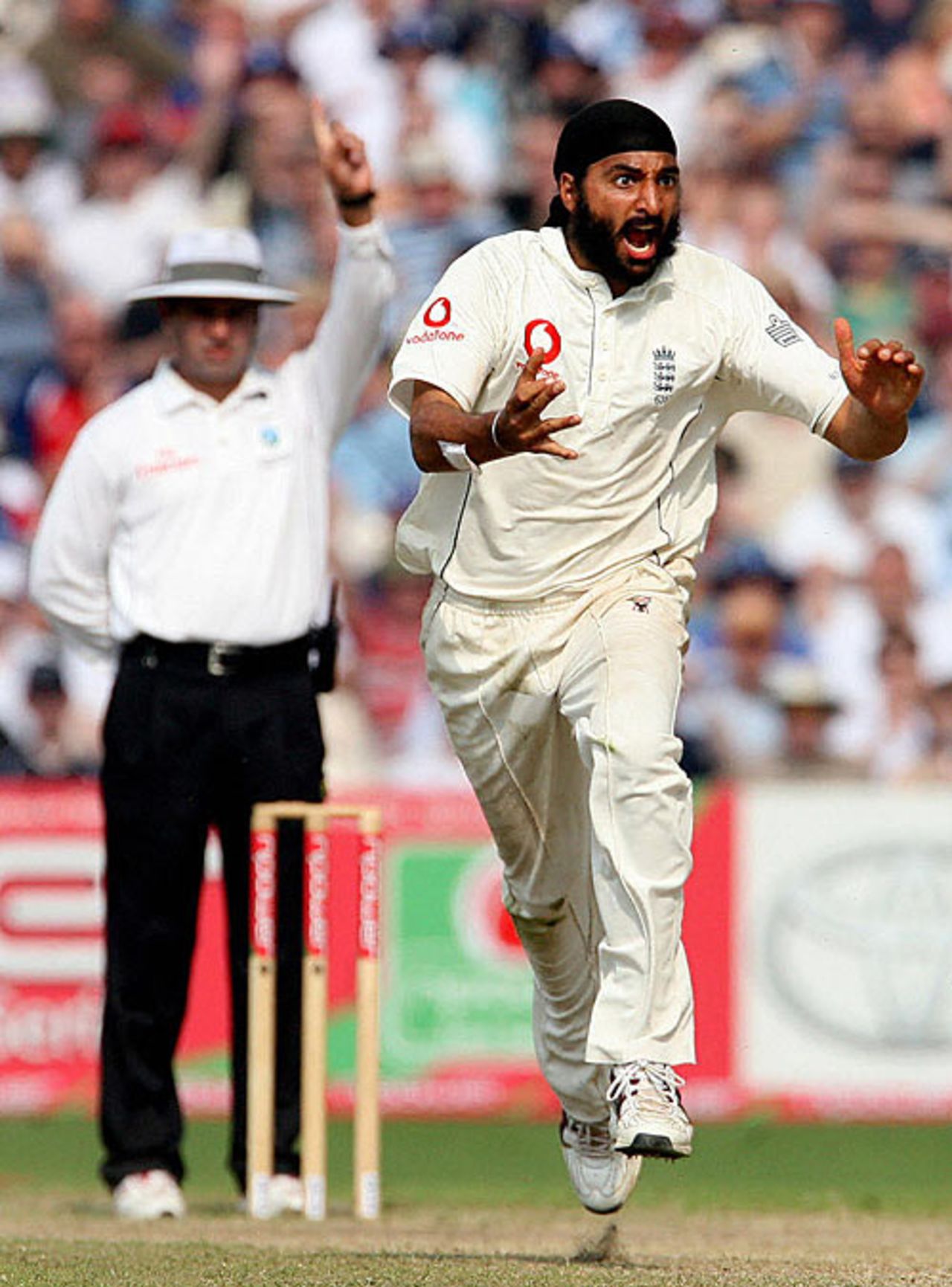 Look at the eyes: Aleem Dar raises his finger, prompting Monty Panesar's wide-eyed celebrations, England v West Indies, 3rd Test, Old Trafford, June 10, 2007