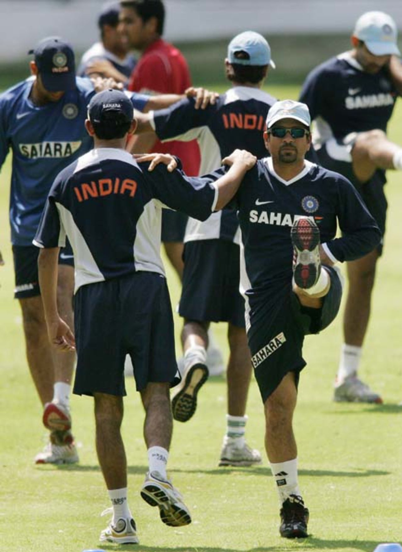 Sachin Tendulkar stretches with his team-mates during the final day of the batsman's camp at the Chinnaswami Stadium, Bangalore, June 12, 2007