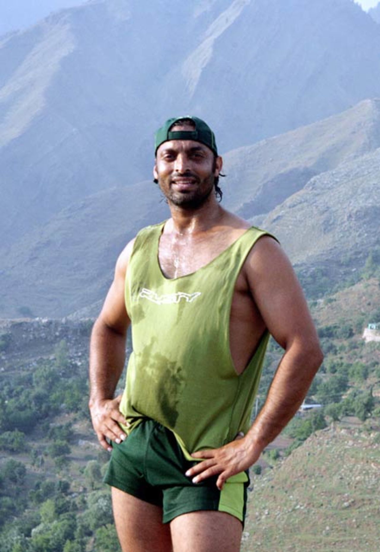 Shoaib Akhtar takes a break during military training at a base in Abbottabad, Pakistan, June 21, 2007