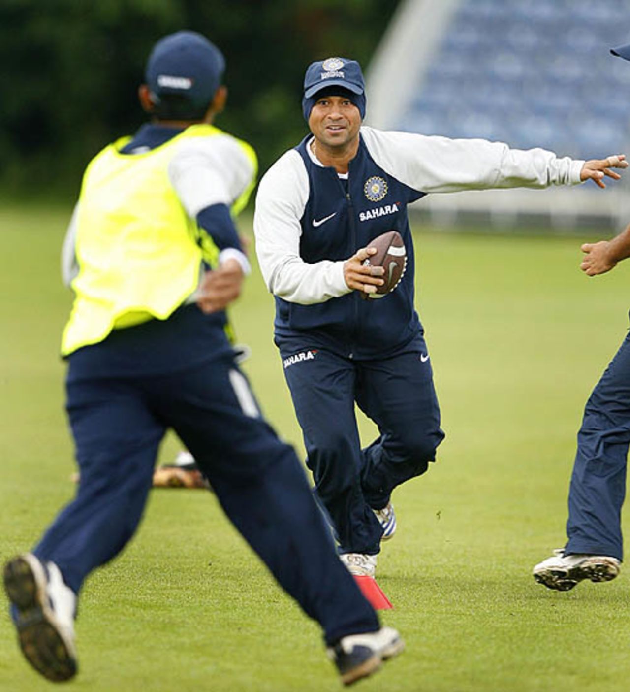 Sachin Tendulkar tries out American football with team-mates at a training session in Belfast, June 22, 2007
