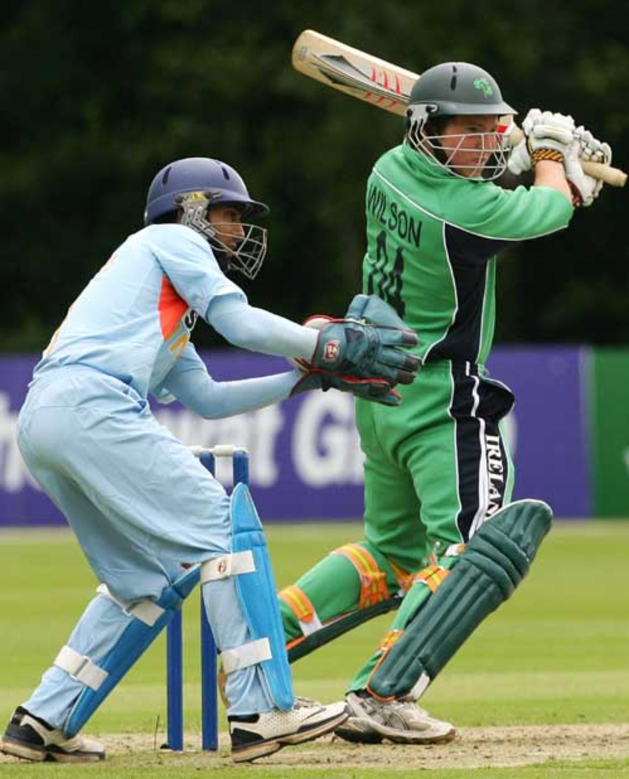 India's wicketkeeper Dinesh Karthik looks on while Gary Wilson plays a cut shot, Ireland v India, Belfast, One-off ODI, June 23, 2007