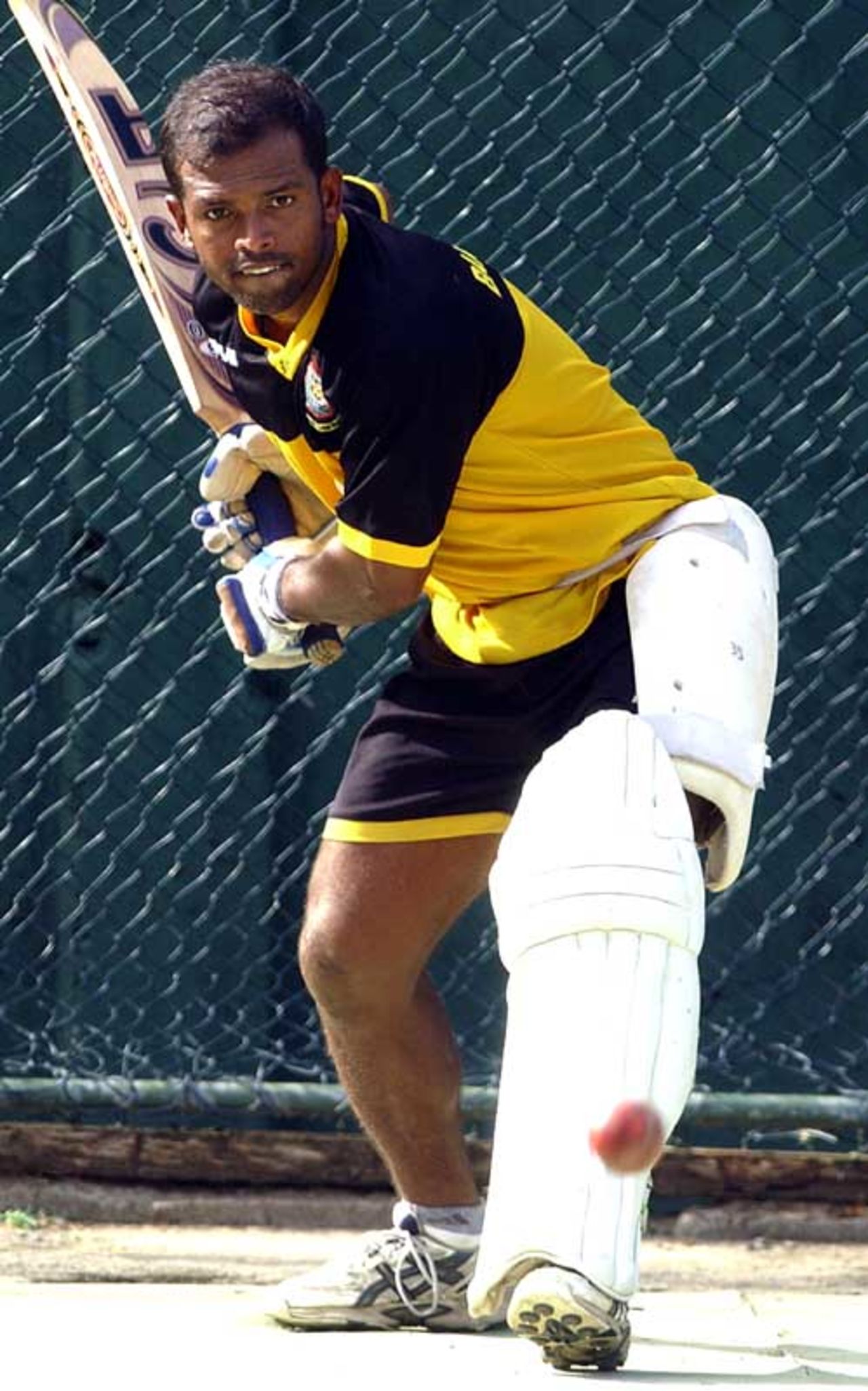 Rajin Saleh watches the ball while getting in line to play a shot during practice at Sinhalese Sports Club, Colombo, June 24, 2007
