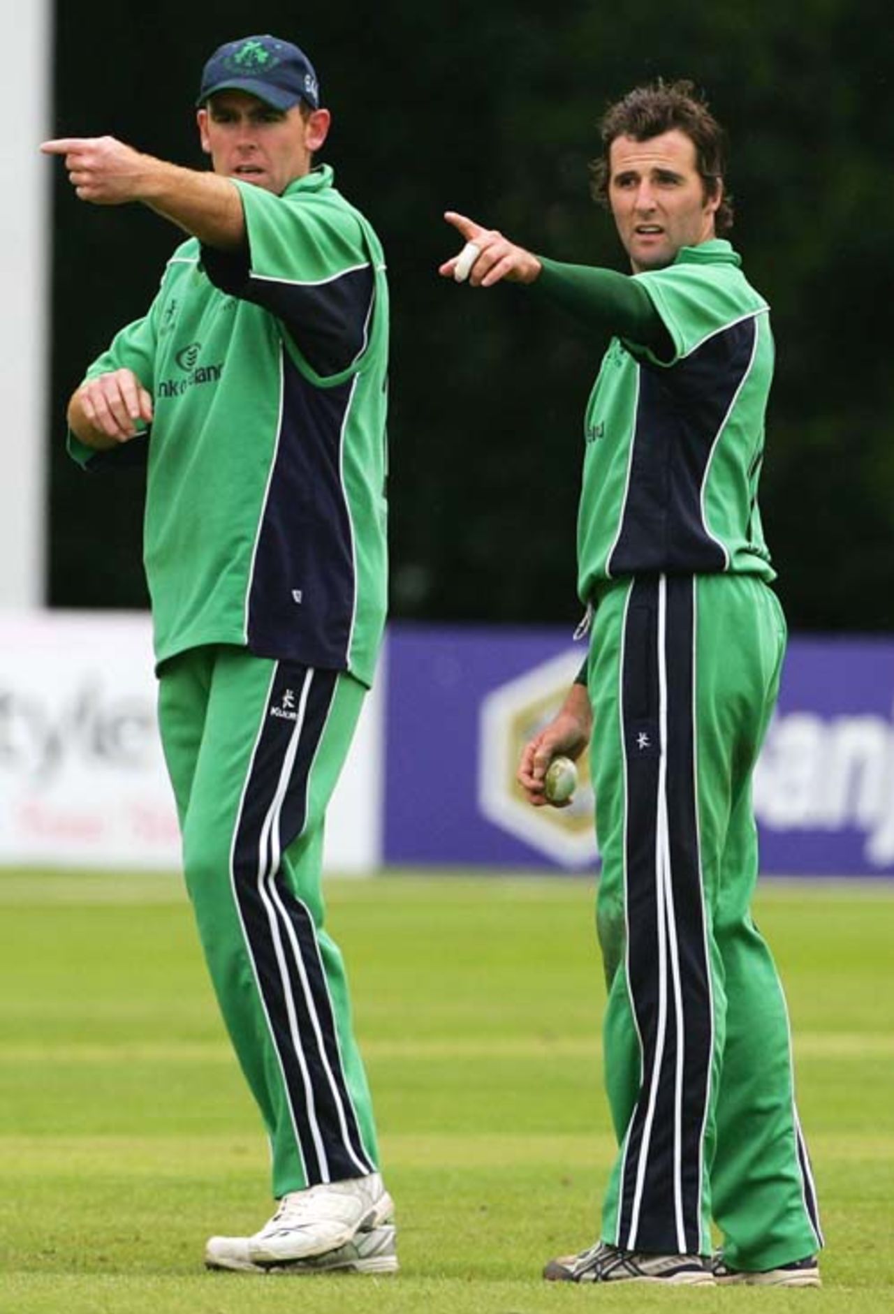 Trent Johnston adjusts the field along with Kyle McCallan, Ireland v South Africa, Belfast, One-off ODI, June 24, 2007
