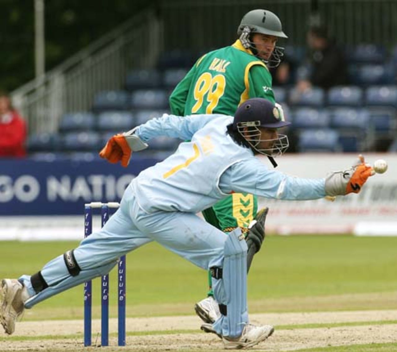 MS Dhoni reaches for the ball as Andrew Hall looks on, India v South Africa, 2nd ODI, Belfast, June 29, 2007