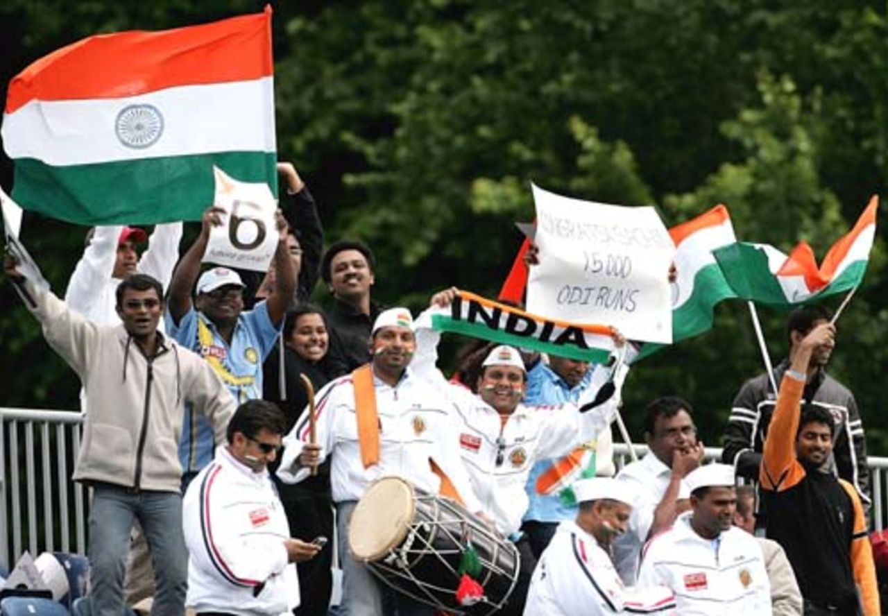 Fans celebrate Sachin Tendulkar of India's 15,000th ODI career run during the second One Day International match between South Africa and India at the Civil Service Cricket Club in Stormont on June 29, 2007