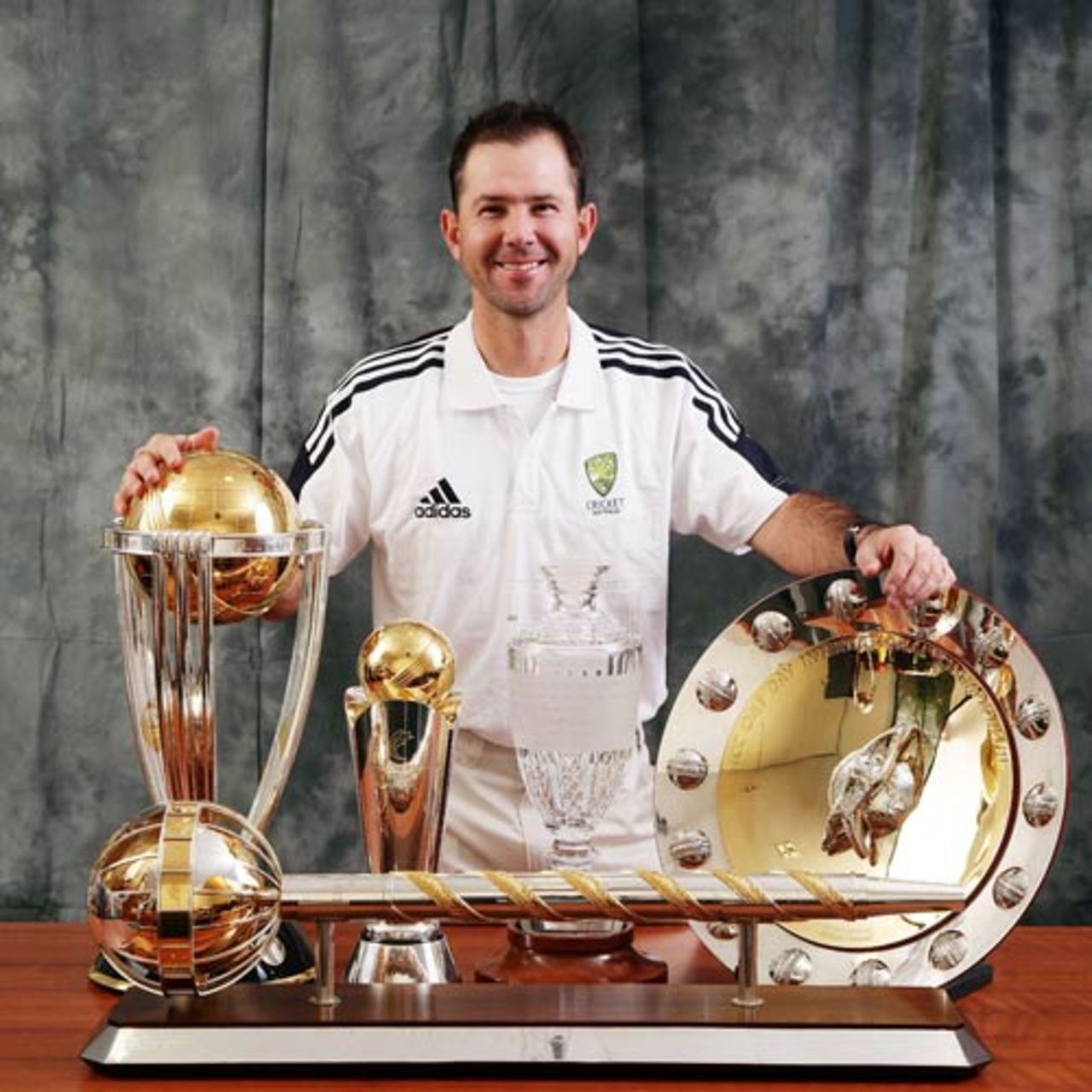 Ricky Ponting poses with (from left) the World Cup, the Champions Trophy, The Ashes, the ICC ODI trophy and the ICC Test trophy (in front), during a portrait session, July 2, 2007