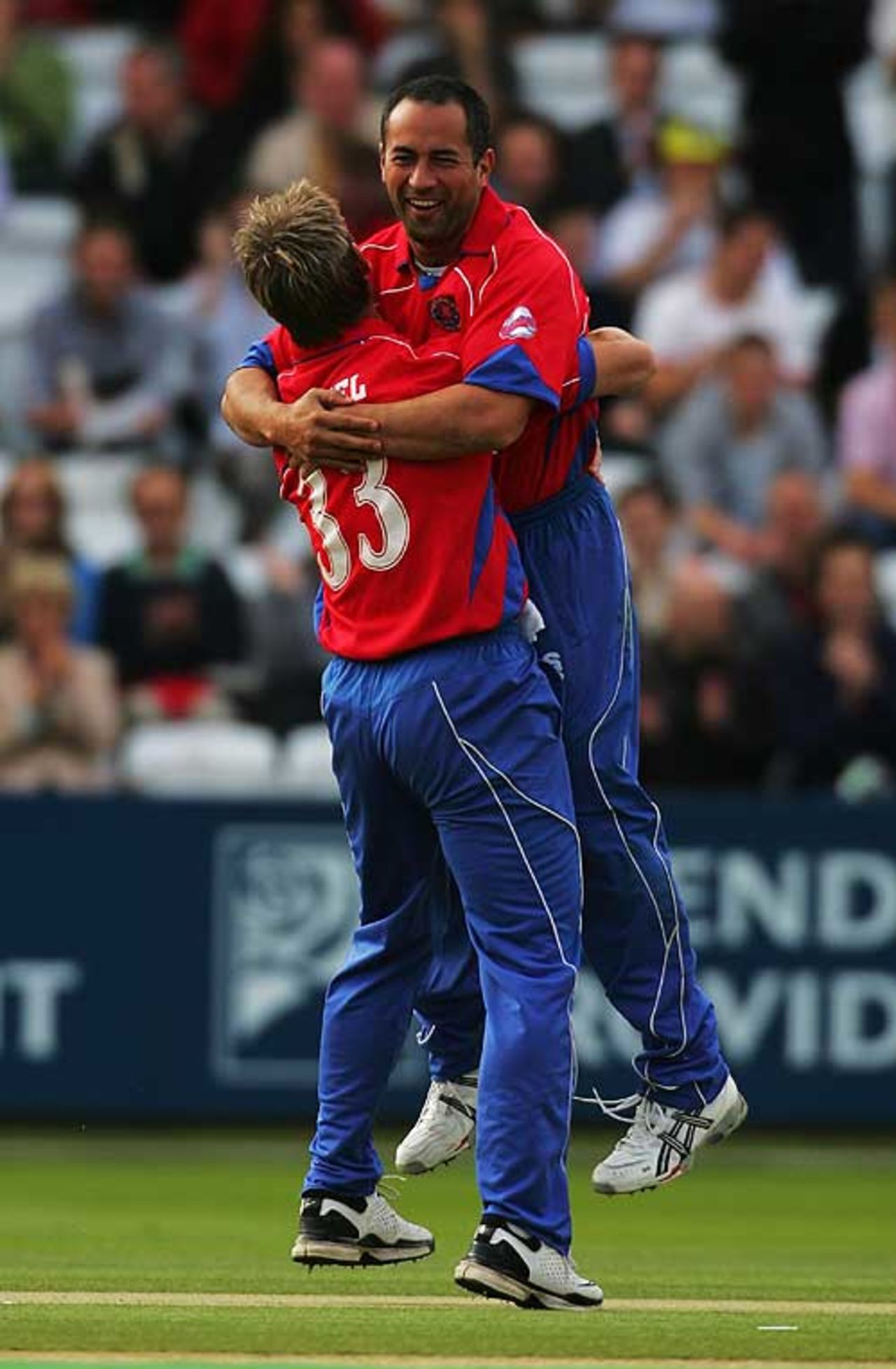 Essex 's Adam Hollioake and Andy Bichel celebrate the dismissal of Middlesex's Andrew Strauss at Lord's, July 6, 2007