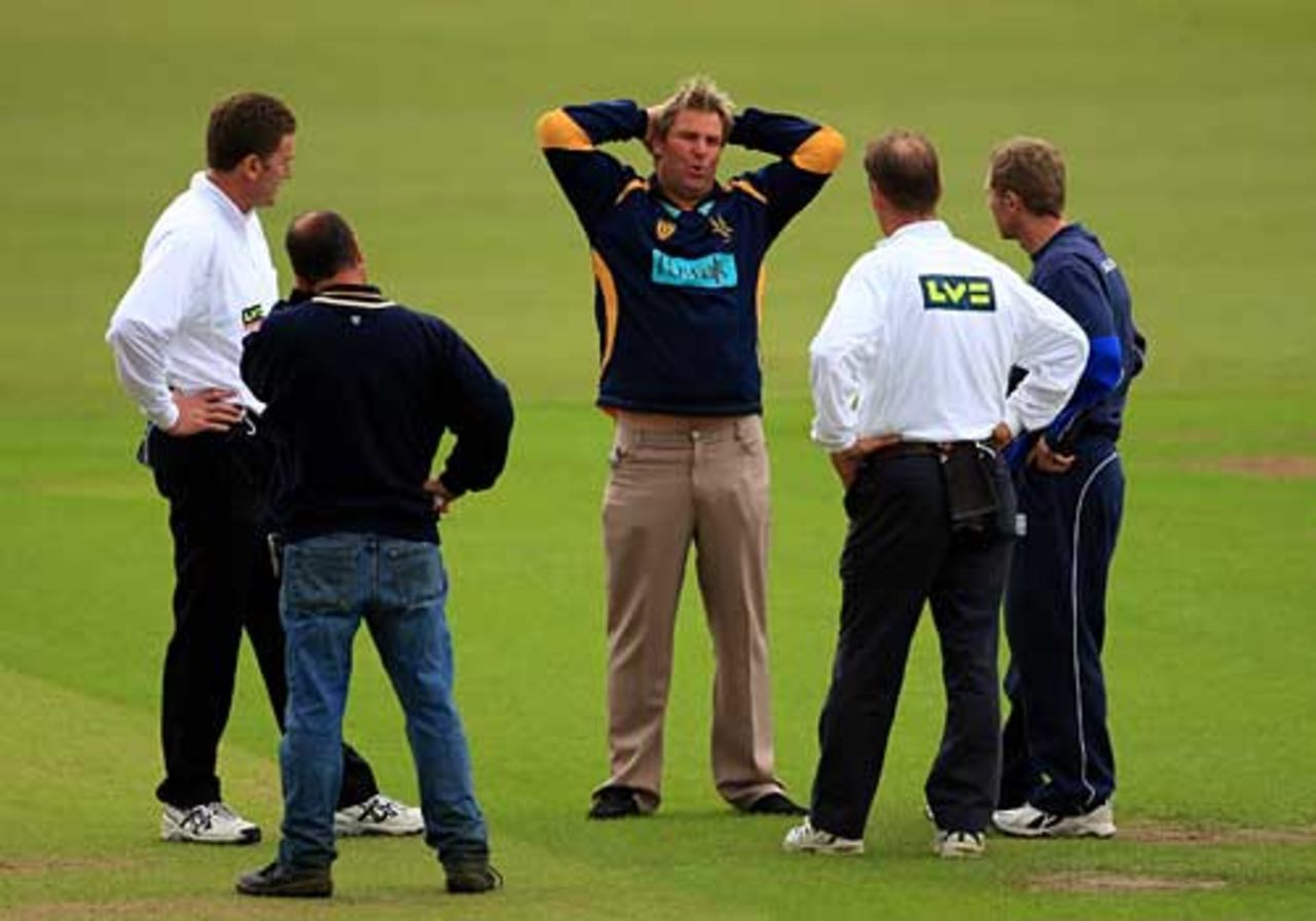 Shane Warne and Darren Maddy discuss the state of The Rose Bowl wicket with the umpires and groundsman, Hampshire v Warwickshire, County Championship, The Rose Bowl, July 10, 2007
