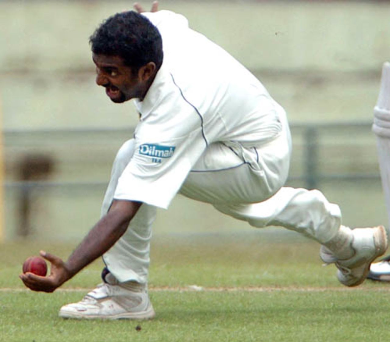 Muttiah Muralitharan dives to catch Mashrafe Mortaza's stroke of his own bowling, Sri Lanka v Bangladesh, 3rd Test, Asgiriya International Stadium, Kandy, 2nd day, July 12, 2007