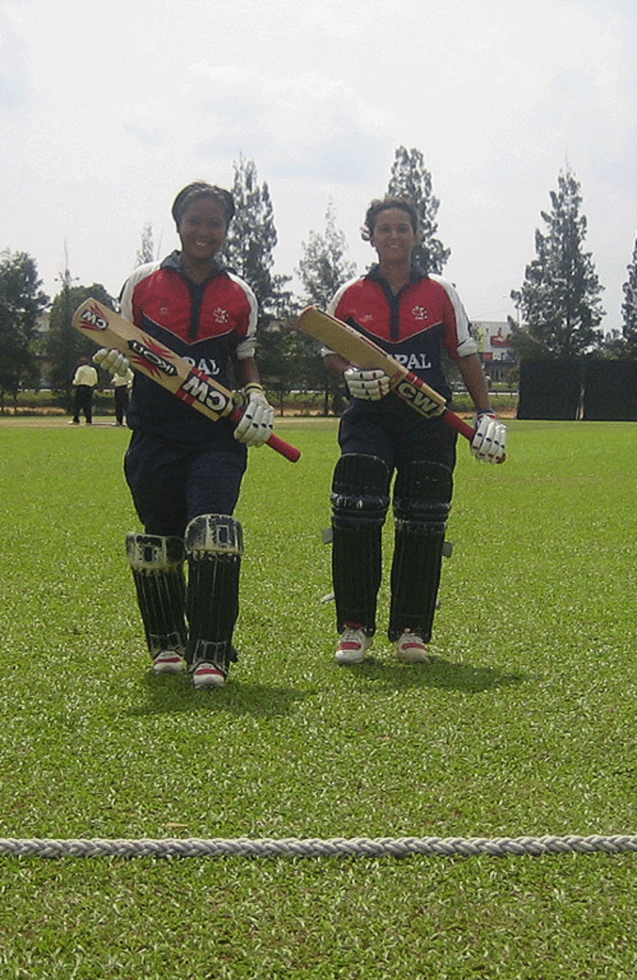 Nary Thapa (left) and Neera Rajopadhyay walk out of the ground after winning the game for Nepal against Hong Kong, Hong Kong women v Nepal women, ACC women's tournament, Johor, July 15, 2007