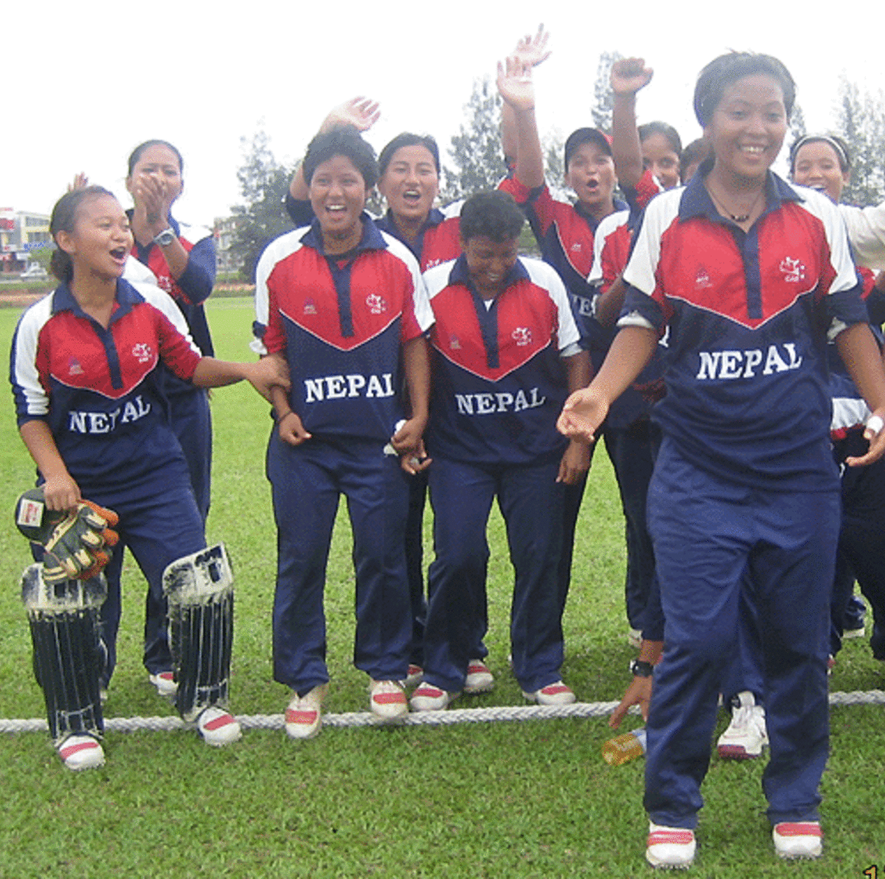 The Nepal players celebrate after qualifying for the semi-finals, Hong Kong women v Nepal women, ACC women's tournament, Johor, July 15, 2007