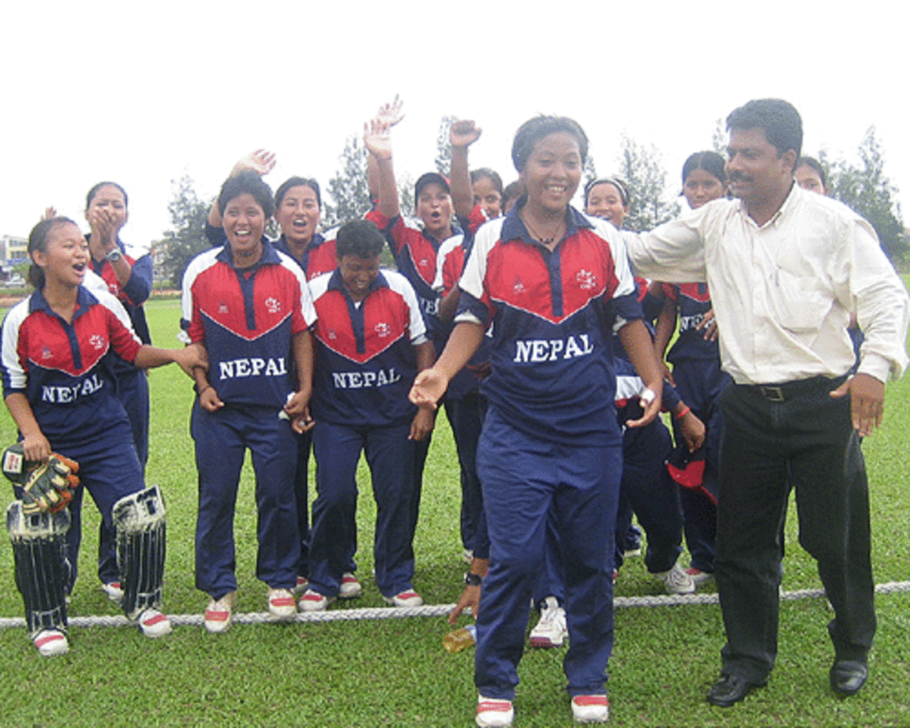 Nepal's manager congratulates Nary Thapa, the captain, and the team for bowling out Hong Kong for 31, Hong Kong v Nepal, ACC women's tournament, Johor, July 15, 2007