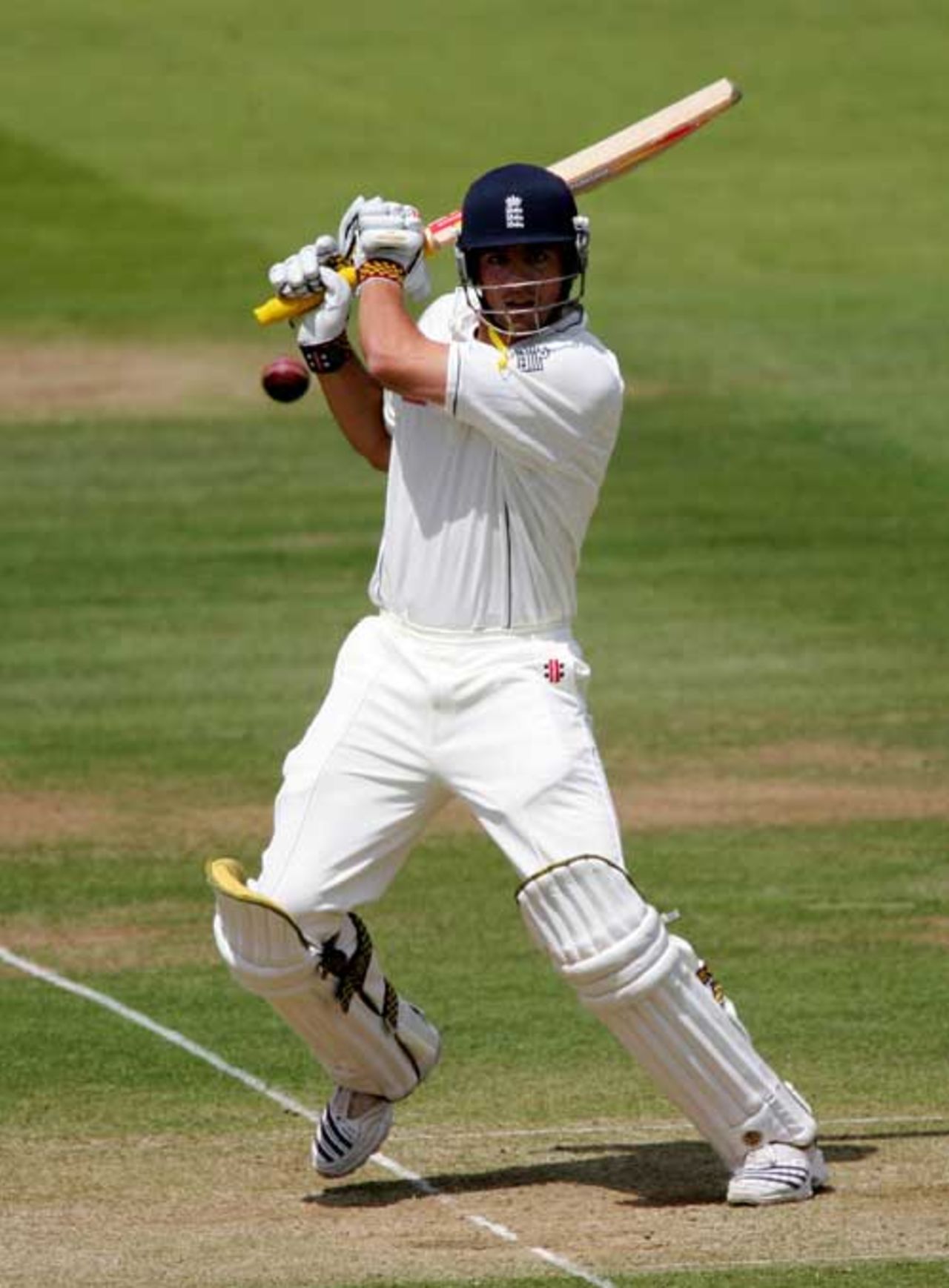 Alastair Cook of England cuts a ball from Dwayne Bravo to the boundary during the fourth day of the first npower test match between England and the West Indies at Lord's cricket ground on May 20, 2007 in London, England