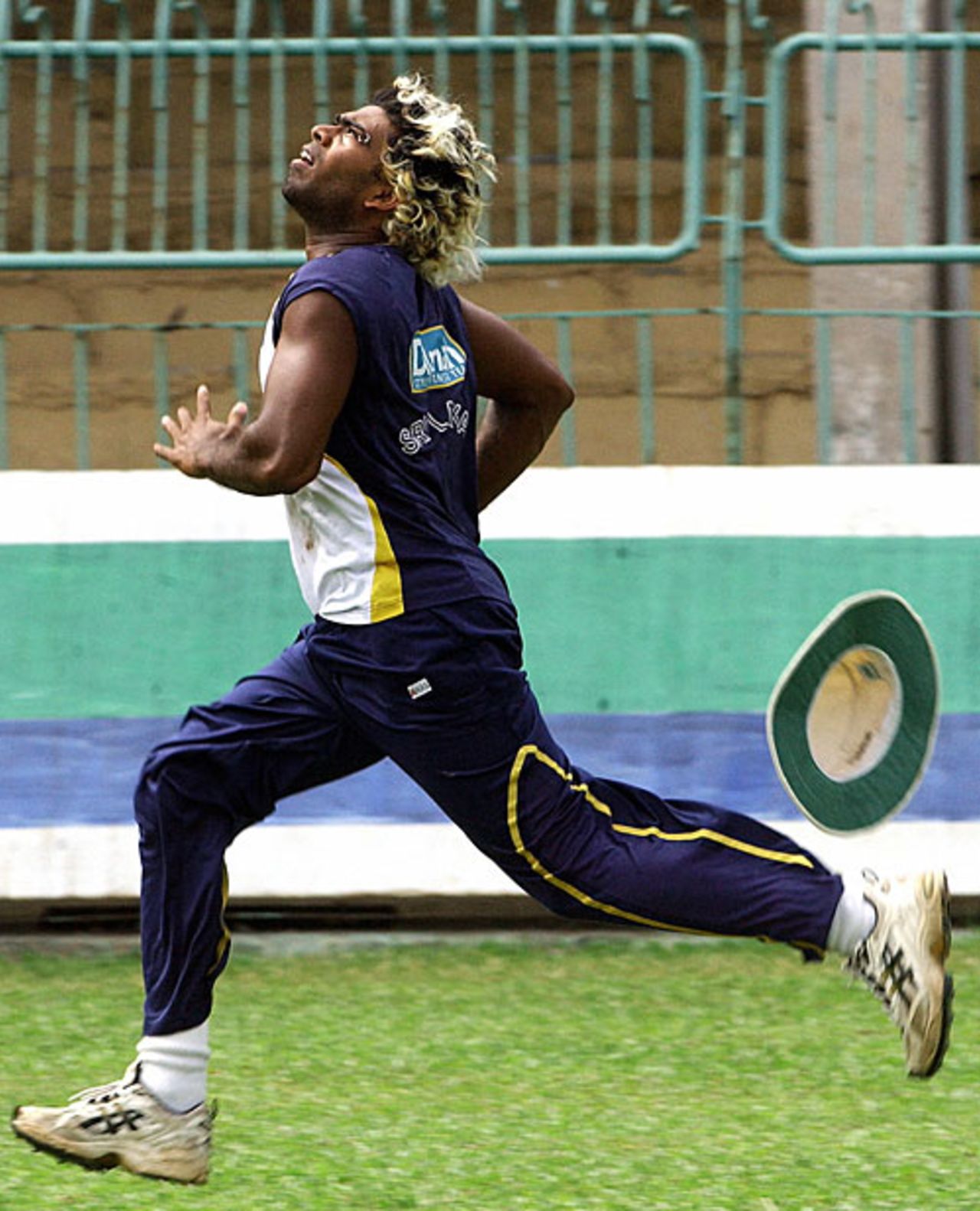 Lasith Malinga runs to catch a ball during a practice session, Colombo, July 17, 2007