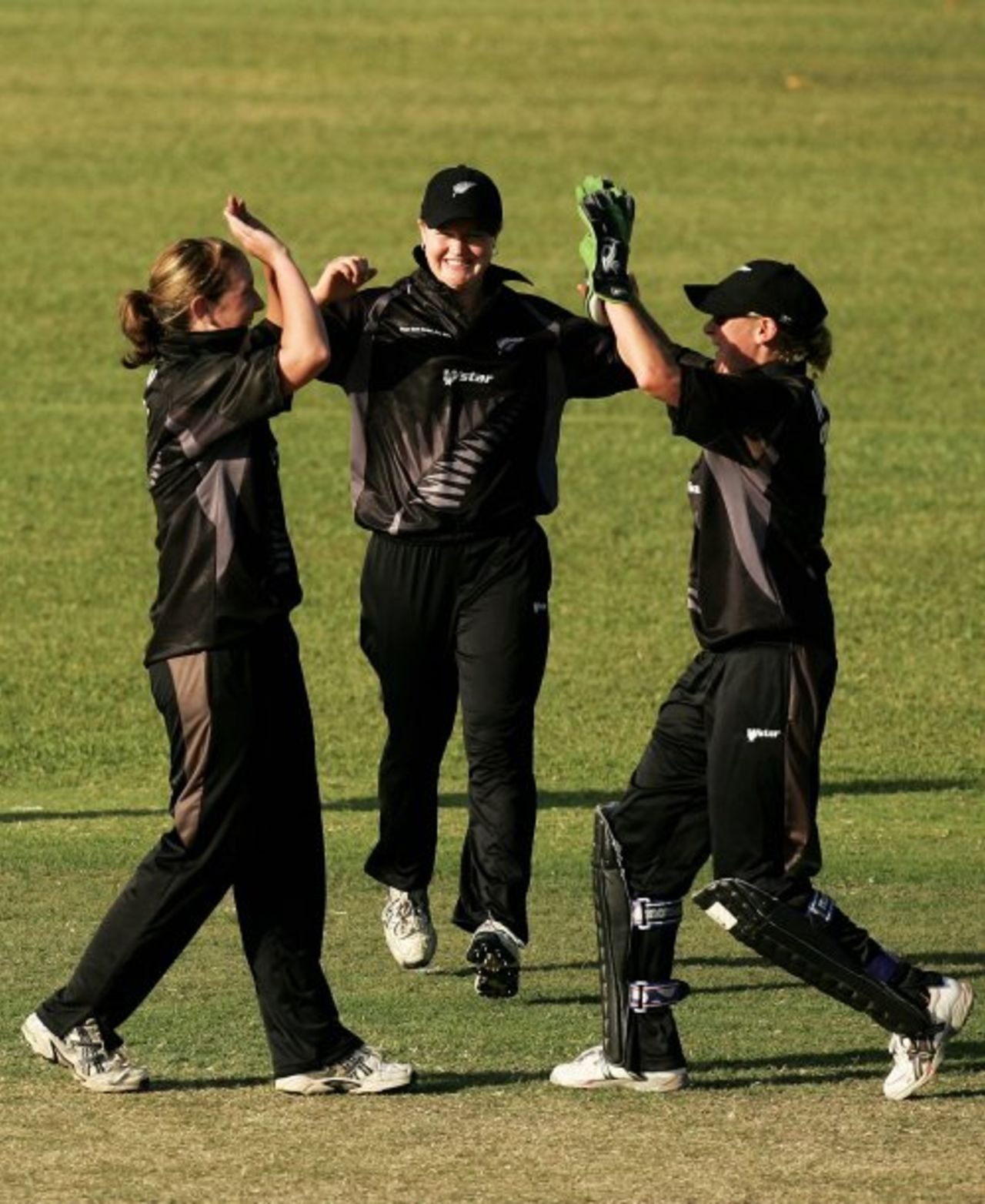Sarah Burke is congratulated by wicketkeeper Rowan Milburn after dismissing Ellyse Perry, Australia women v New Zealand women, 2nd ODI, Darwin, July 22, 2007