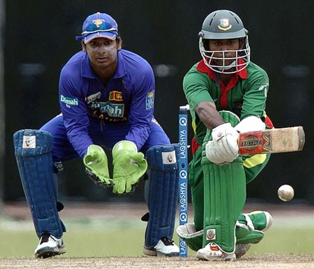 Aftab Ahmed plays a reverse-sweep as Kumar Sangakkara looks on, Sri Lanka v Bangladesh, 2nd ODI, Colombo, July 23, 2007