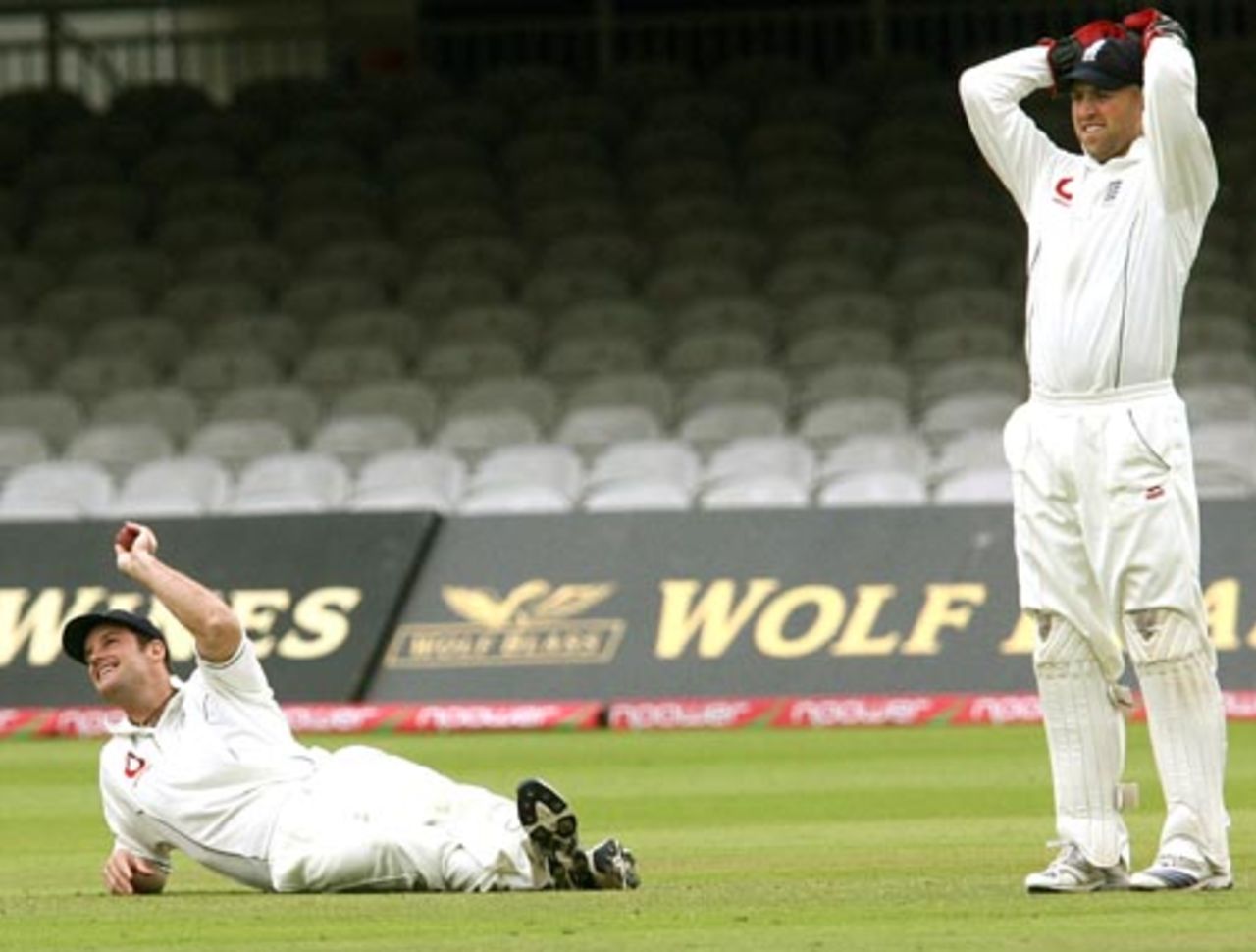 Andrew Strauss lies on the ground as Matt Prior rues a missed opportunity, England v India, 1st Test, Lord's, 5th day, July 23, 2007 