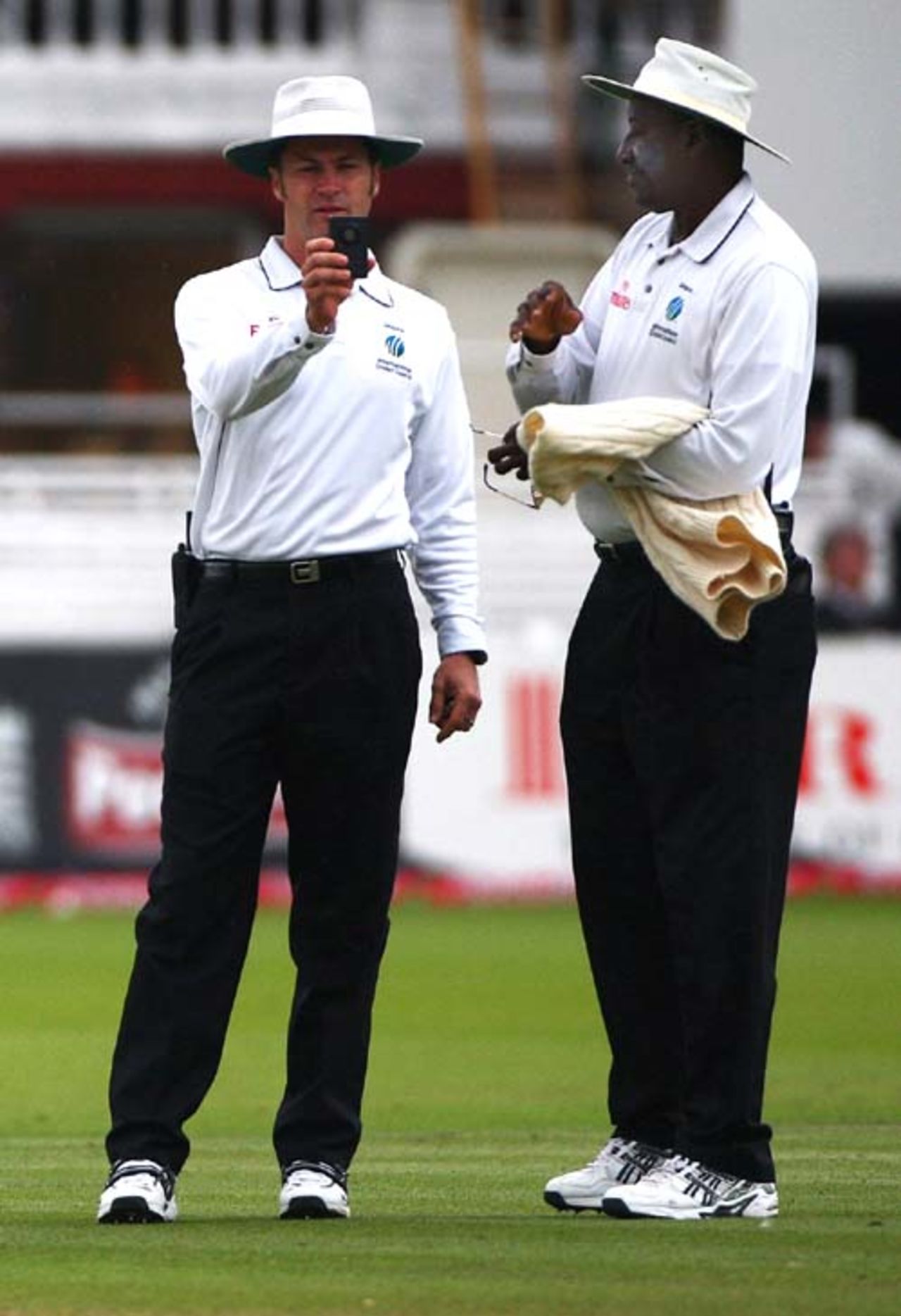 Simon Taufel checks the light while Steve Bucknor looks on, England v India, 1st Test, Lord's, 5th day, July 23, 2007 