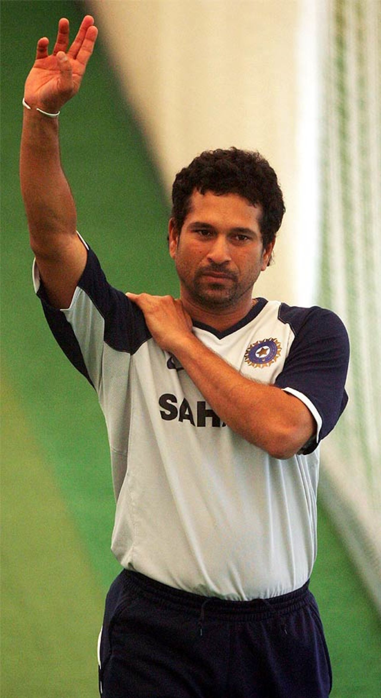 Sachin Tendulkar stretches his bowling arm in the nets, July 25, 2007