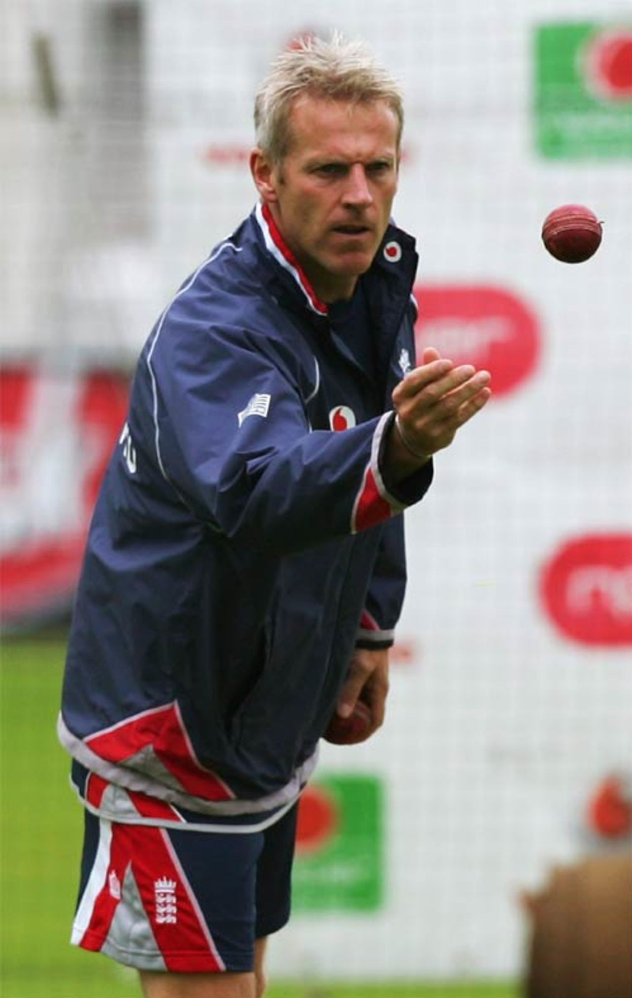 Peter Moores gets ready to catch the ball in an England net session, July 25, 2007